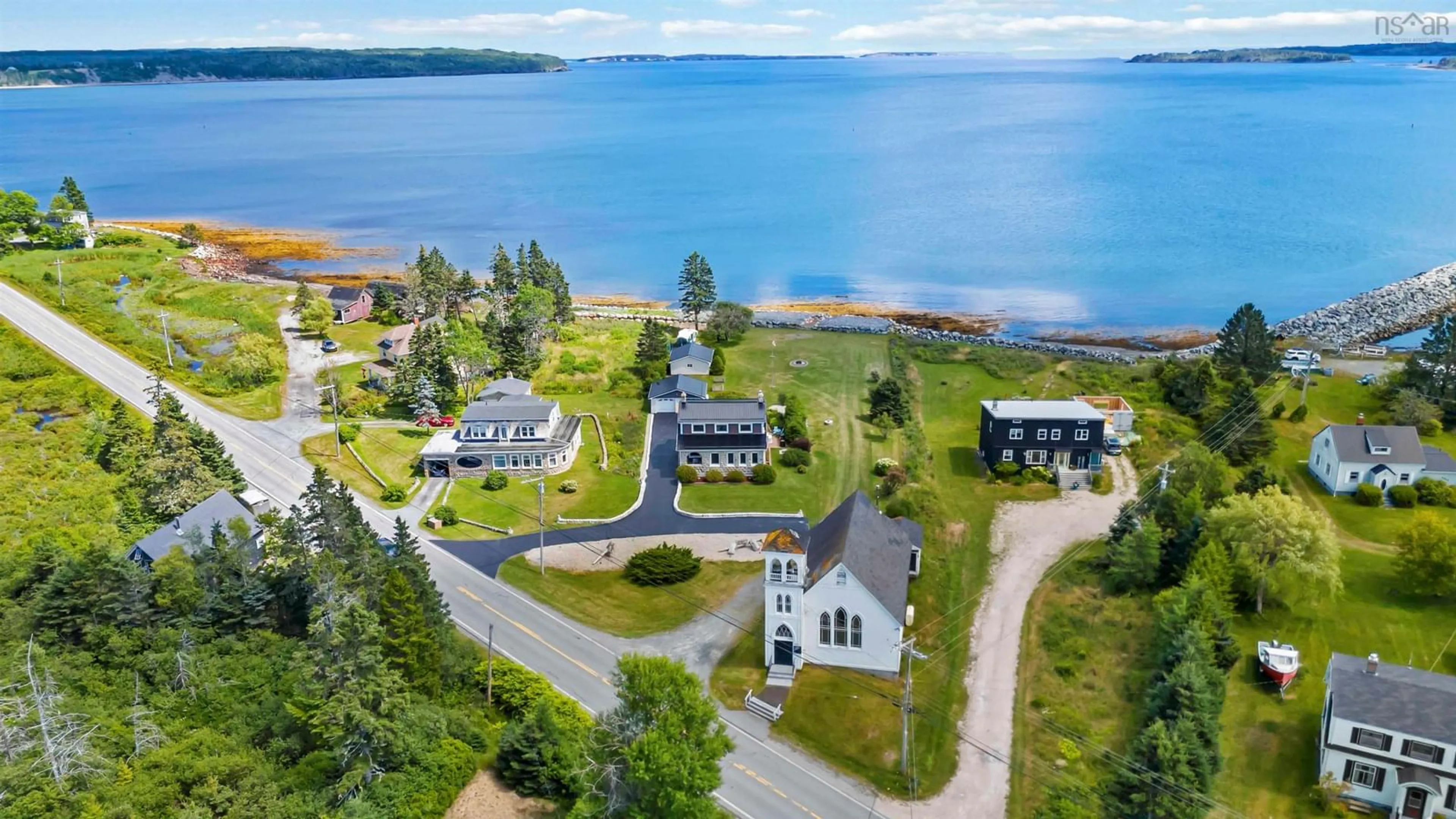 A pic from outside/outdoor area/front of a property/back of a property/a pic from drone, water/lake/river/ocean view for 4027 331 Hwy, Dublin Shore Nova Scotia B0R 1C0