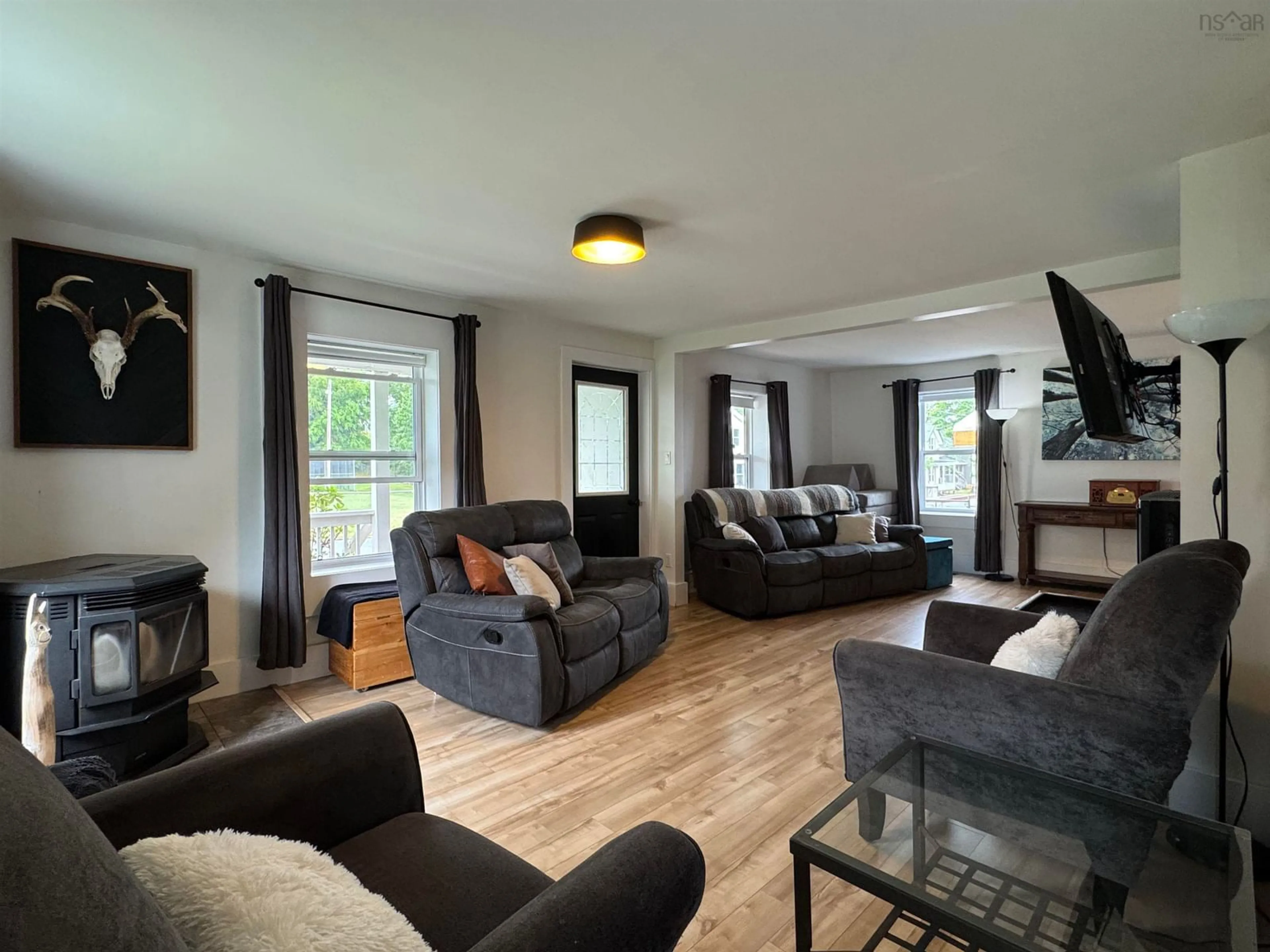 Living room with furniture, wood/laminate floor for 107 Stellar St, Stellarton Nova Scotia B0K 1S0