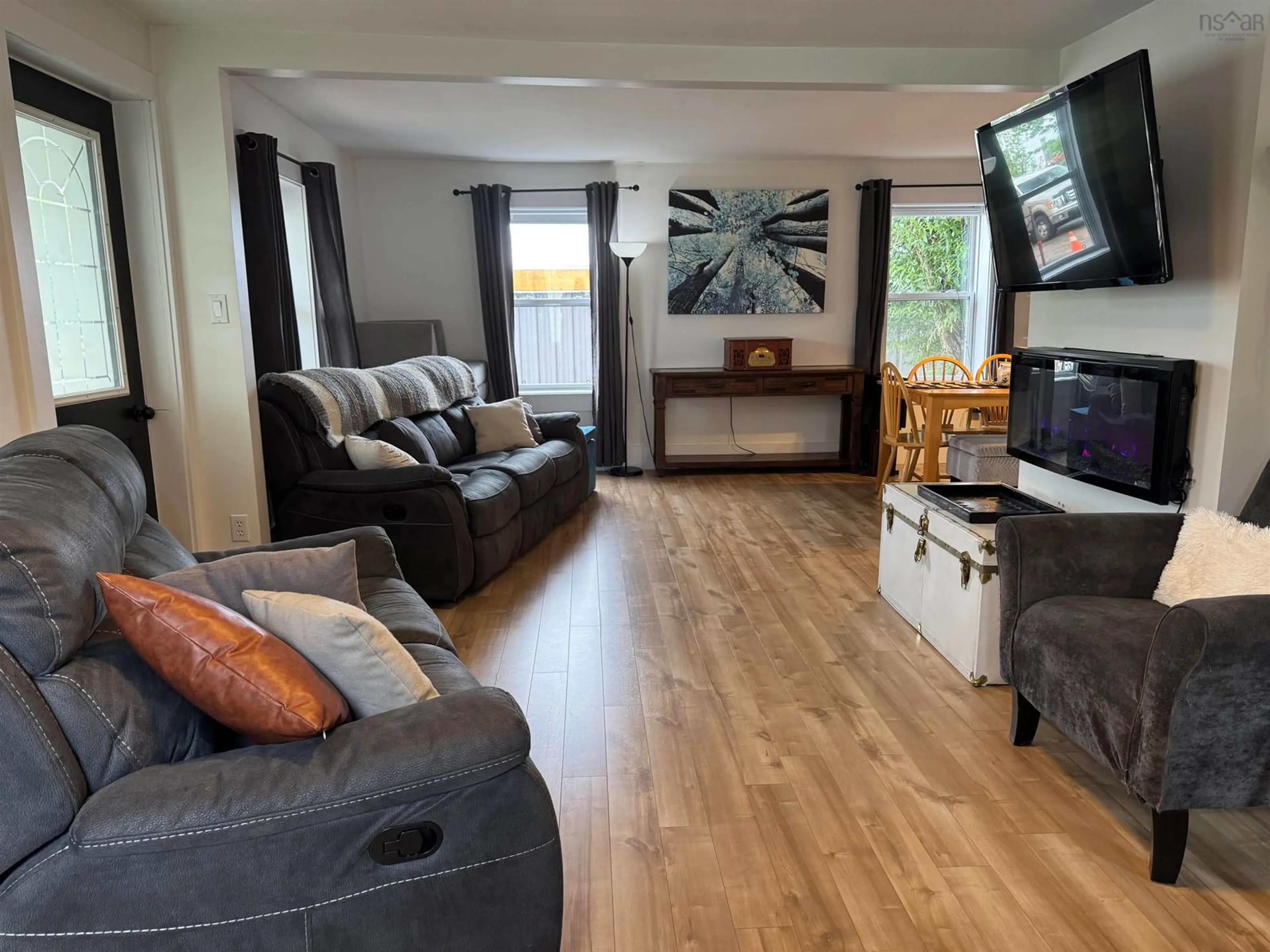 Living room with furniture, wood/laminate floor for 107 Stellar St, Stellarton Nova Scotia B0K 1S0