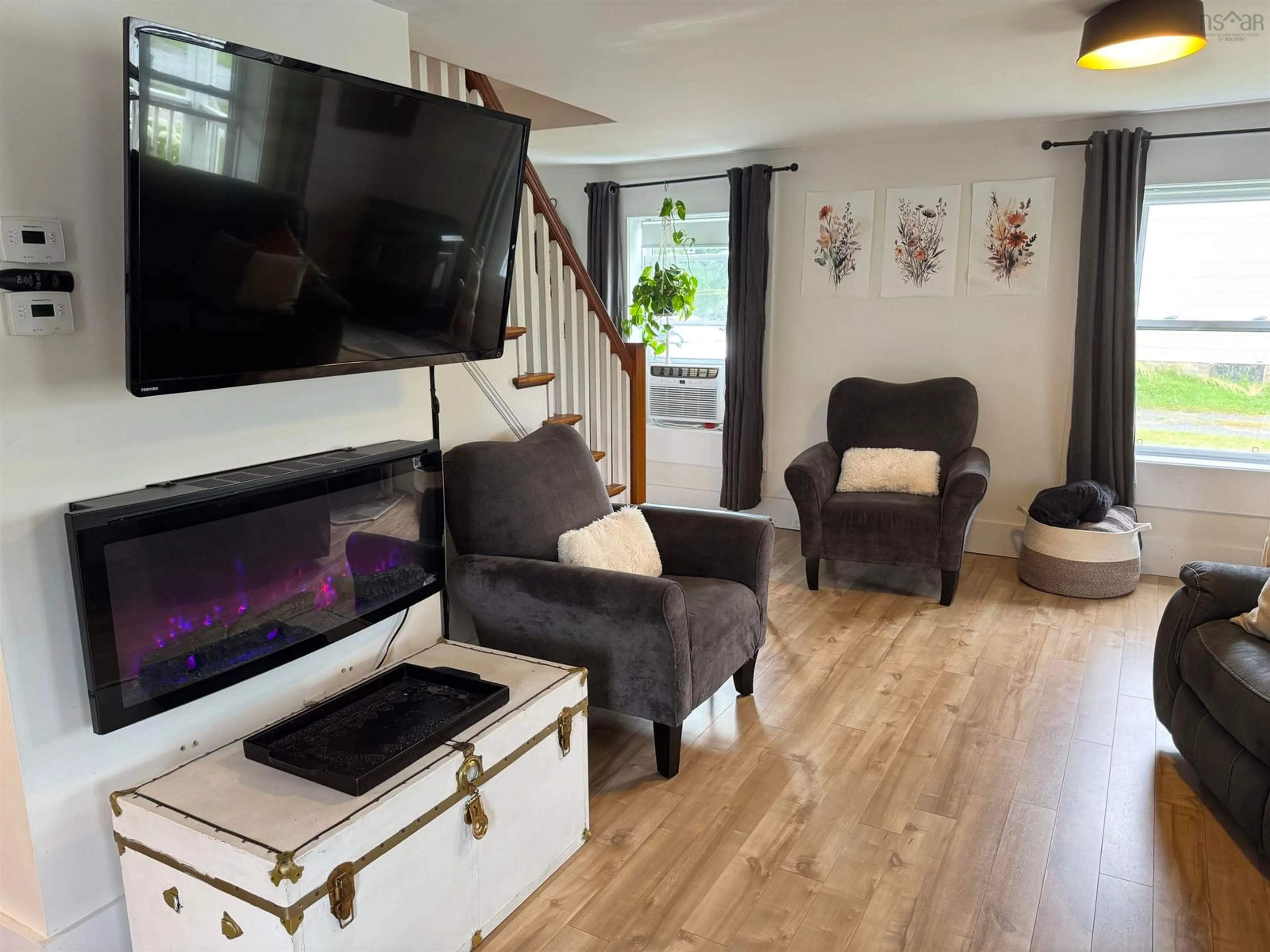 Living room with furniture, wood/laminate floor for 107 Stellar St, Stellarton Nova Scotia B0K 1S0