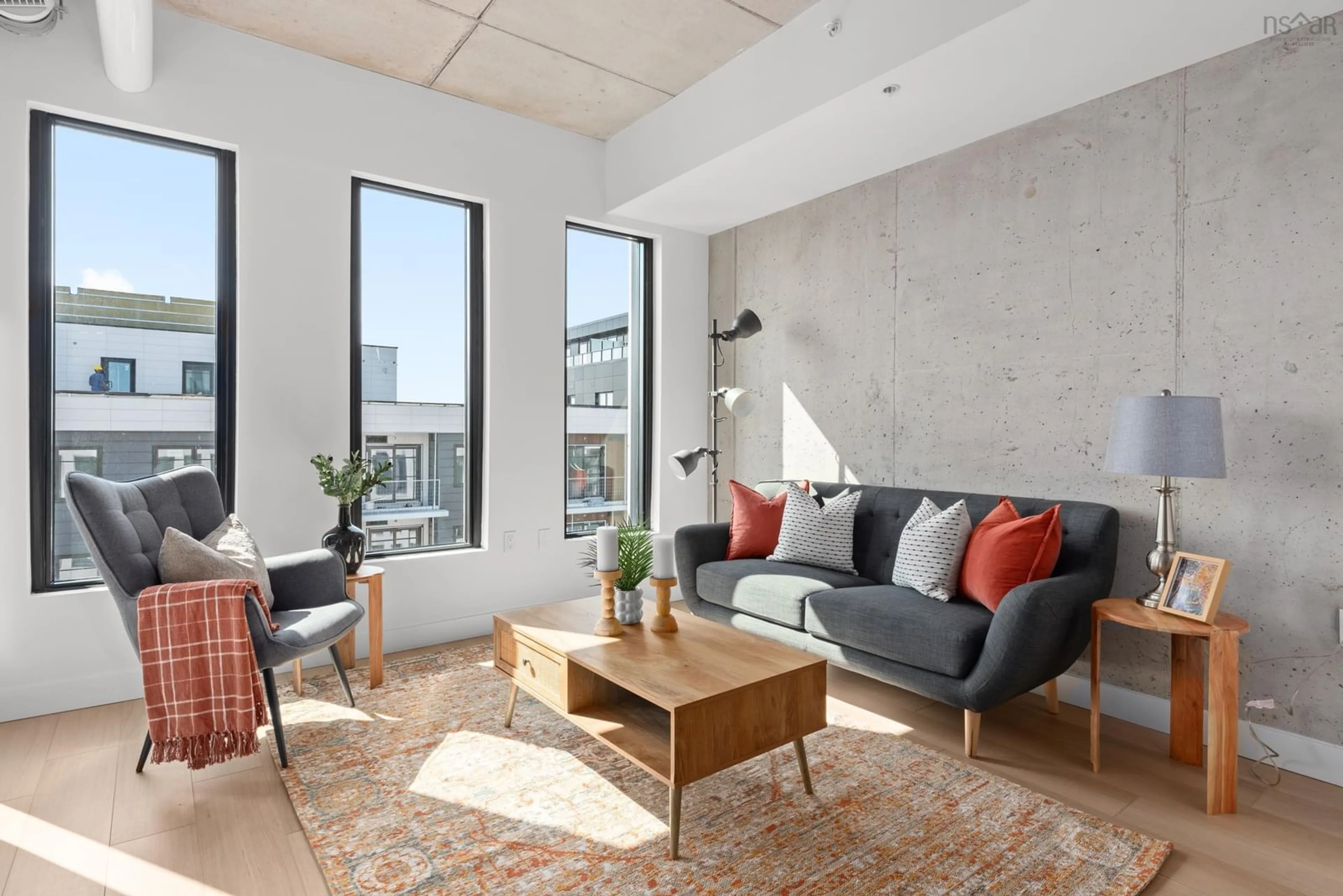 Living room with furniture, cement floor for 5511 Bilby St #702, Halifax Nova Scotia B3K 0M5