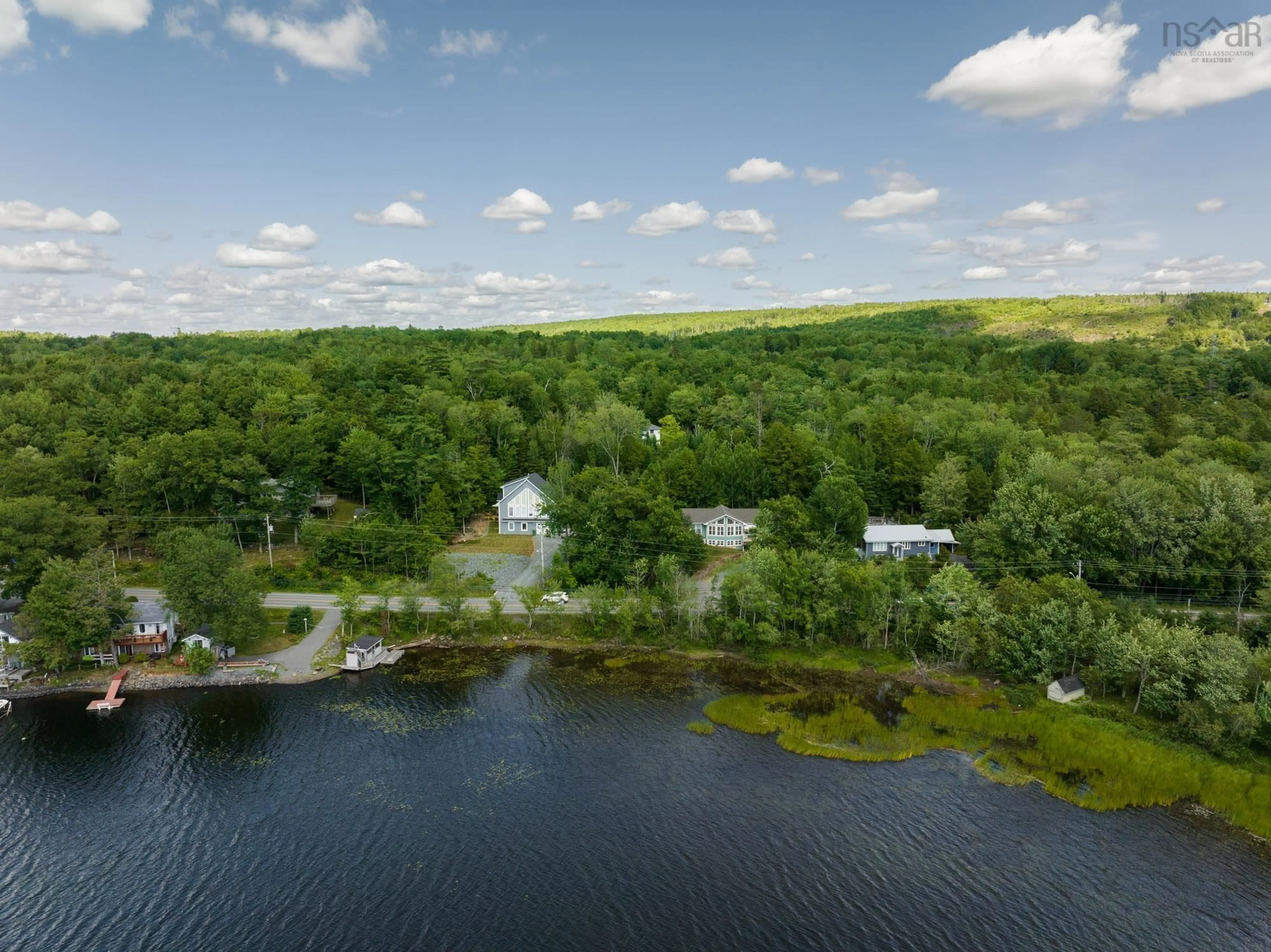 A pic from outside/outdoor area/front of a property/back of a property/a pic from drone, water/lake/river/ocean view for 4038 Highway 2, Fletchers Lake Nova Scotia B2T 1A3
