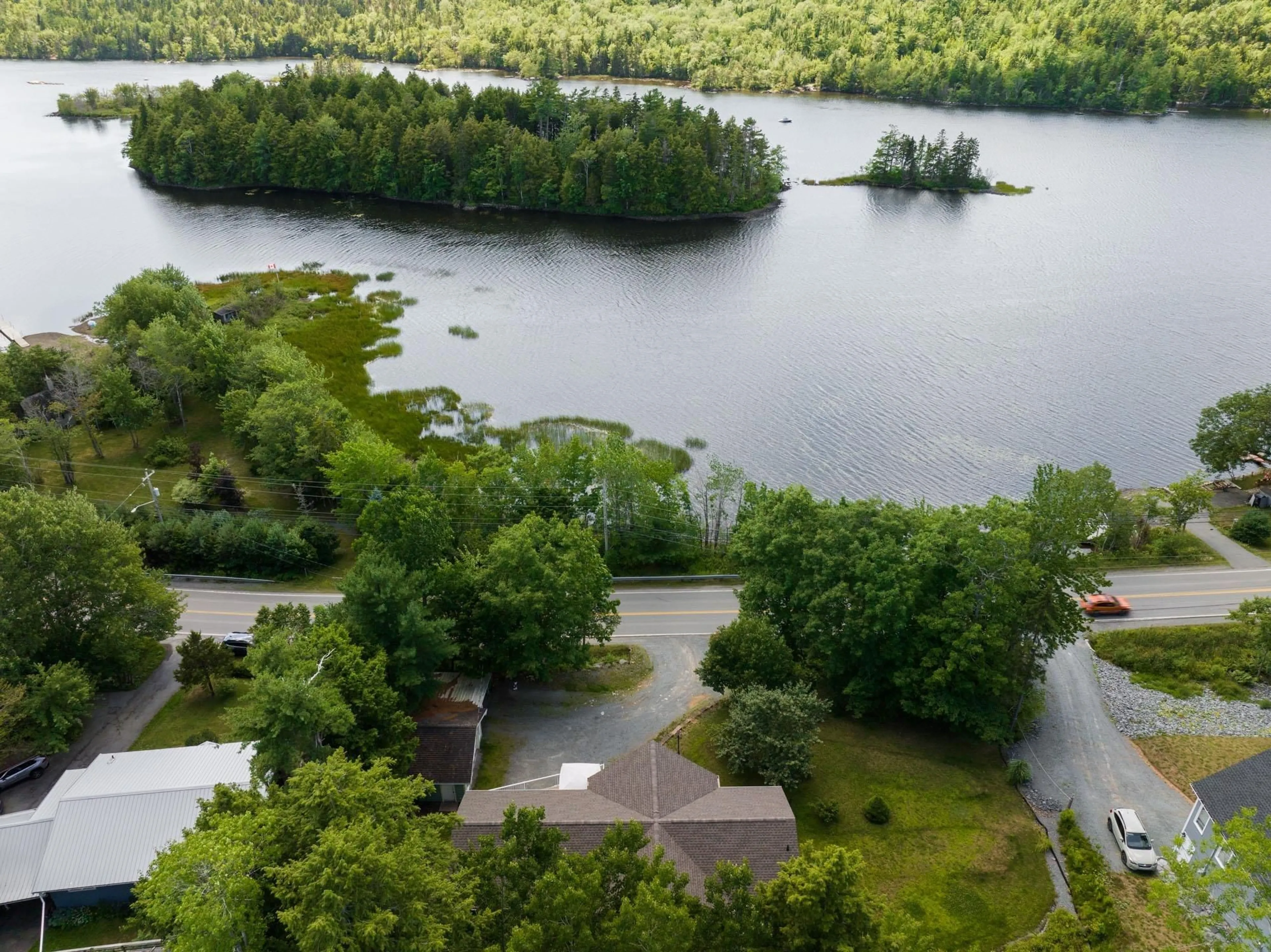A pic from outside/outdoor area/front of a property/back of a property/a pic from drone, water/lake/river/ocean view for 4038 Highway 2, Fletchers Lake Nova Scotia B2T 1A3