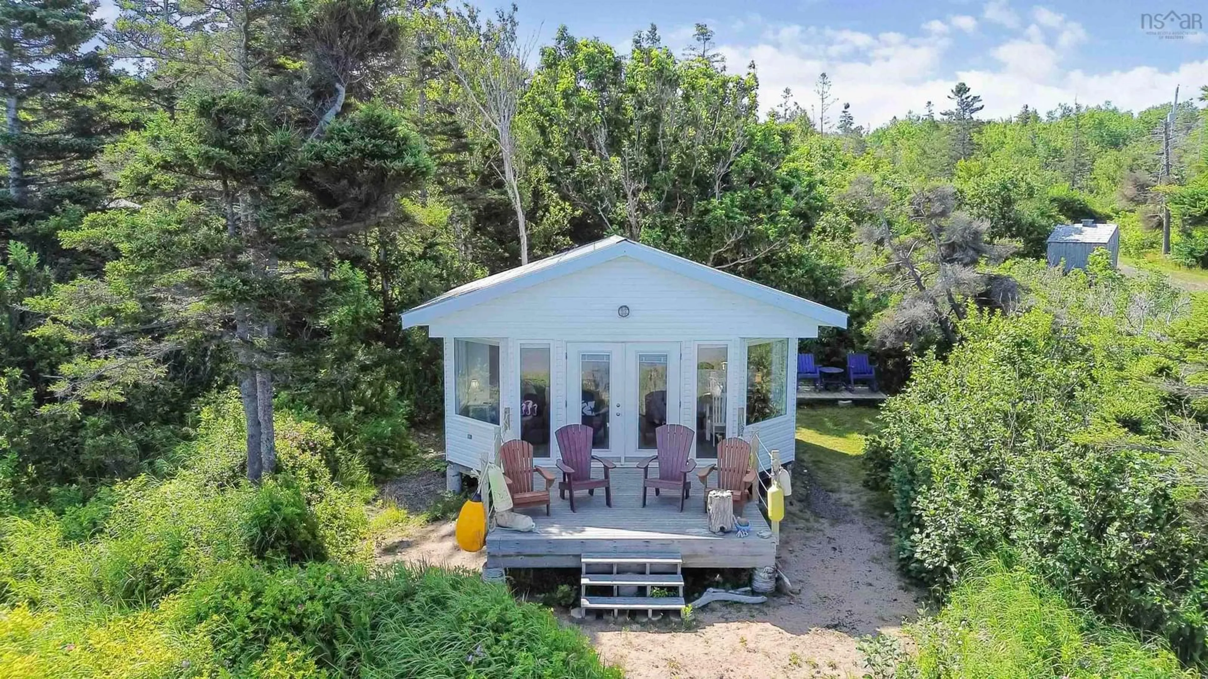 A pic from outside/outdoor area/front of a property/back of a property/a pic from drone, water/lake/river/ocean view for 51 Sunset Ave, Phinneys Cove Nova Scotia B0S 1L0