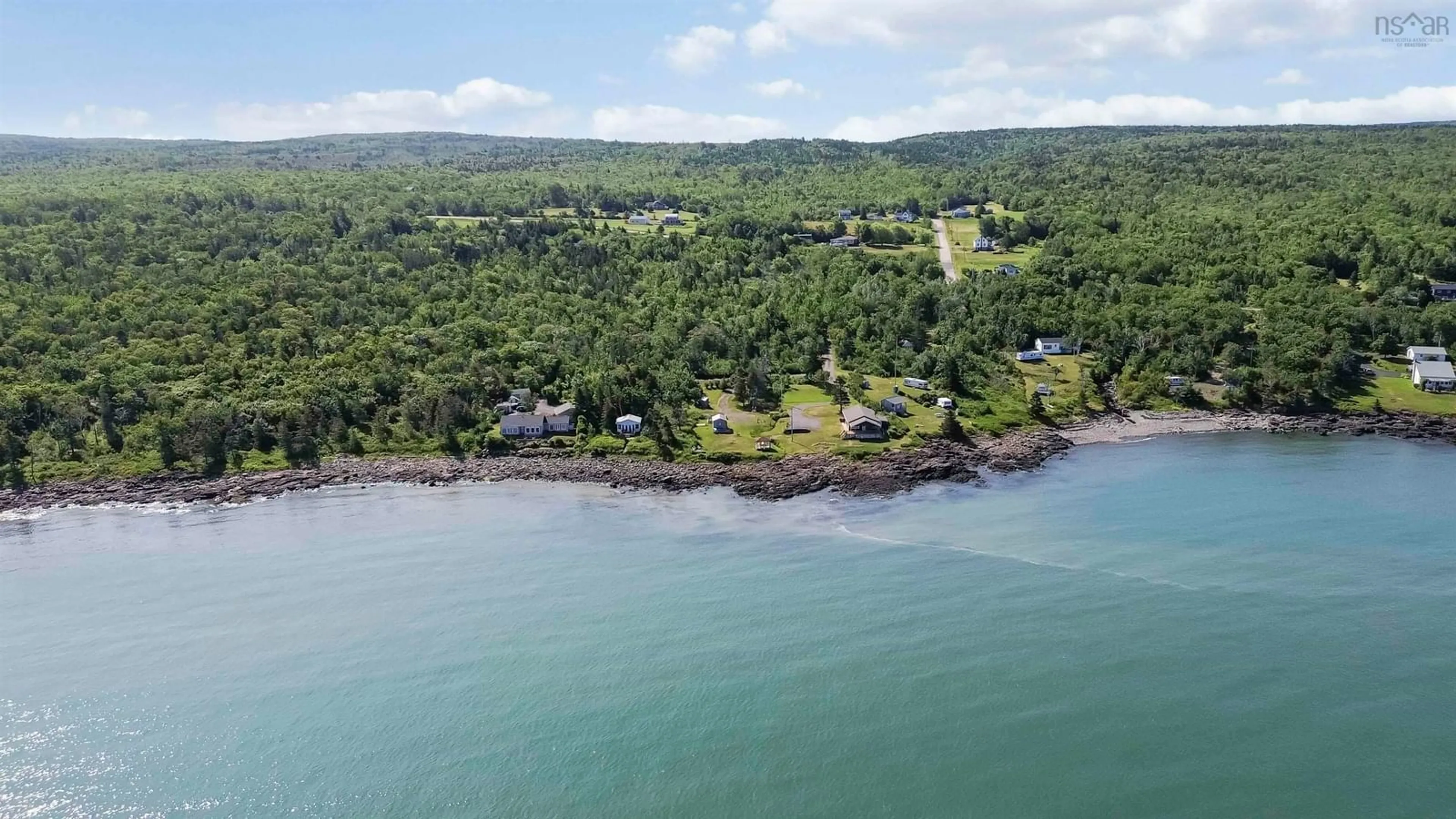 A pic from outside/outdoor area/front of a property/back of a property/a pic from drone, water/lake/river/ocean view for 51 Sunset Ave, Phinneys Cove Nova Scotia B0S 1L0