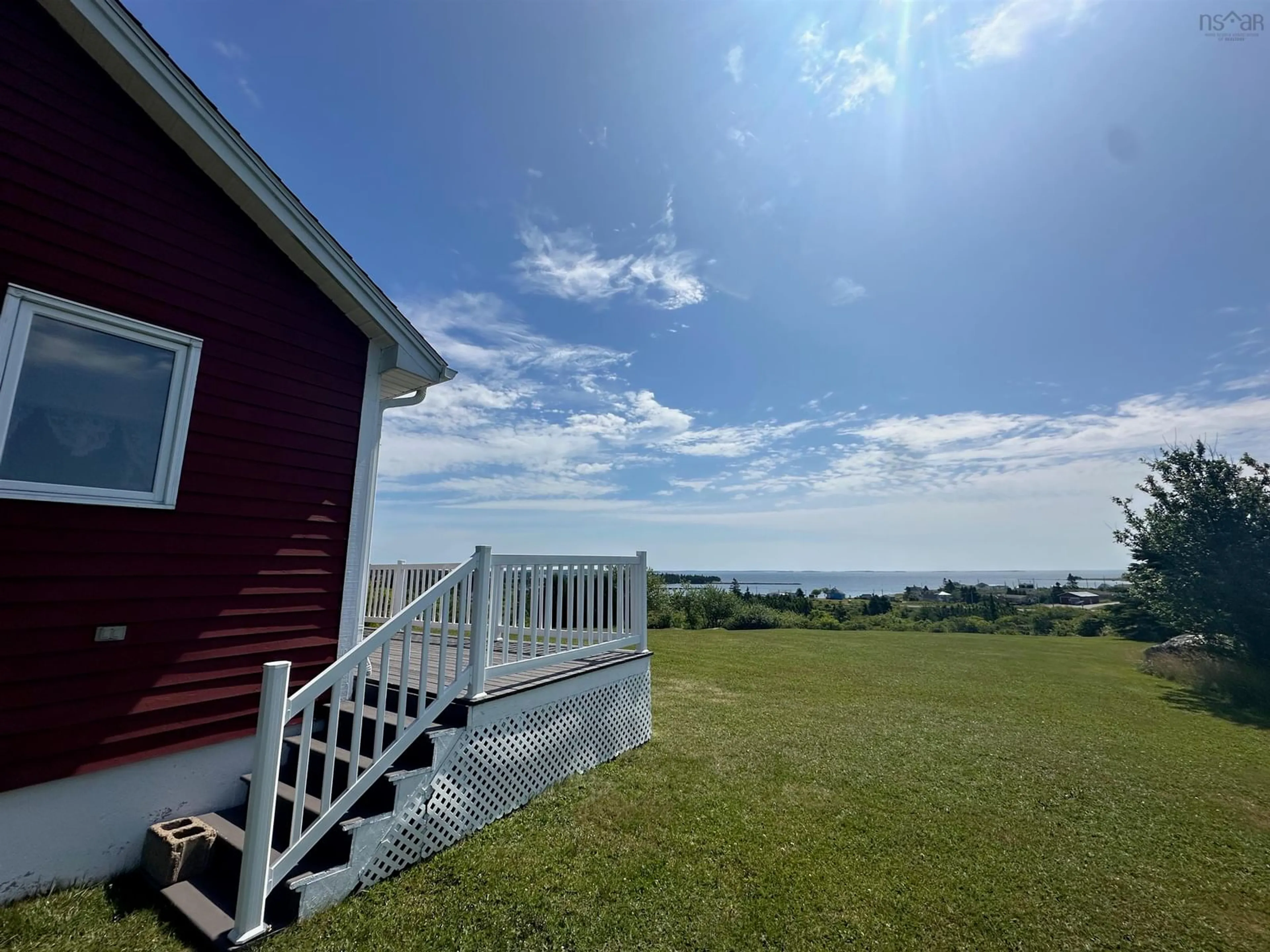 A pic from outside/outdoor area/front of a property/back of a property/a pic from drone, water/lake/river/ocean view for 25 North Road, Charlos Cove Nova Scotia B0H 1T0
