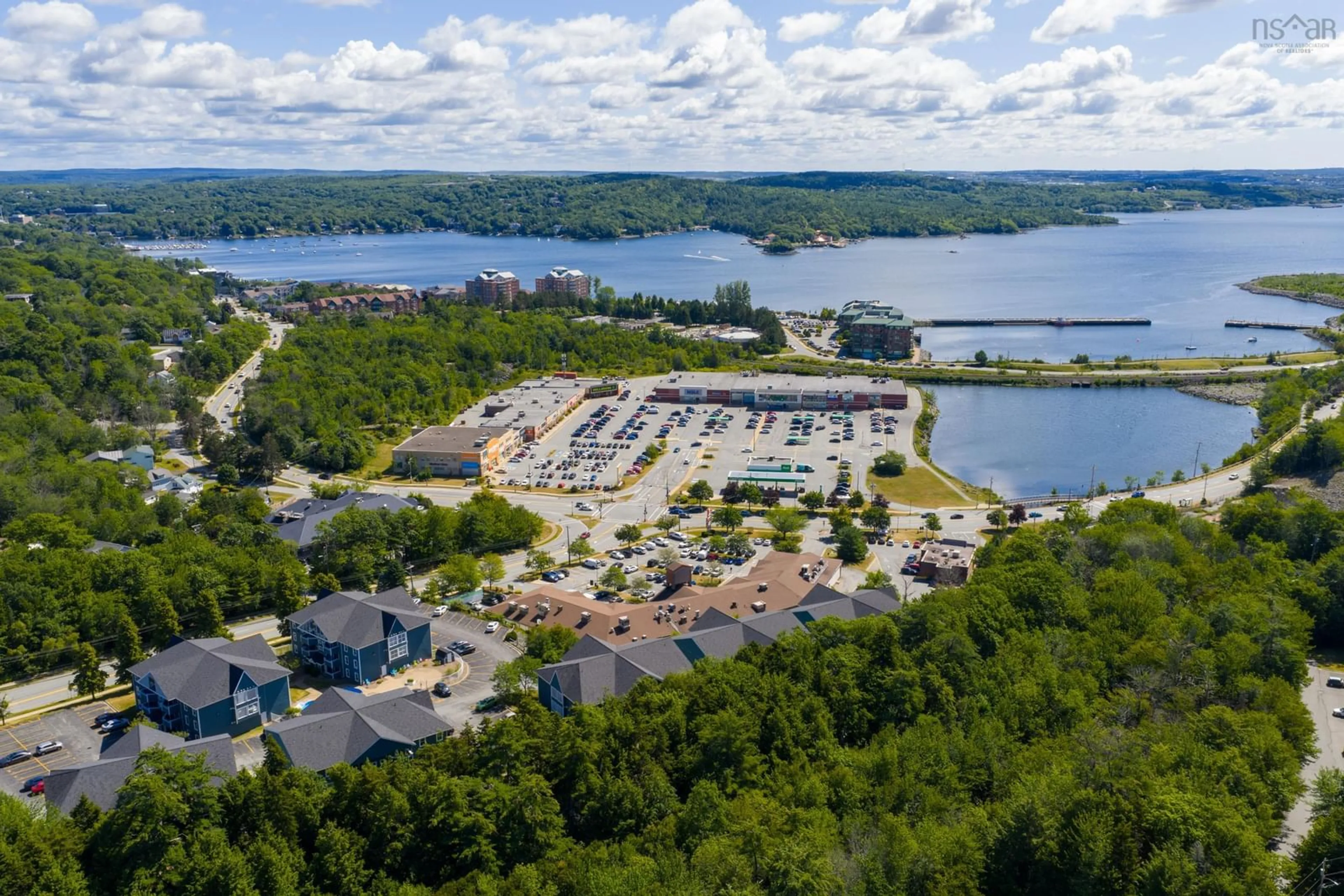 A pic from outside/outdoor area/front of a property/back of a property/a pic from drone, water/lake/river/ocean view for 24 Hammonds Plans Rd #232, Bedford Nova Scotia B4A 3P3