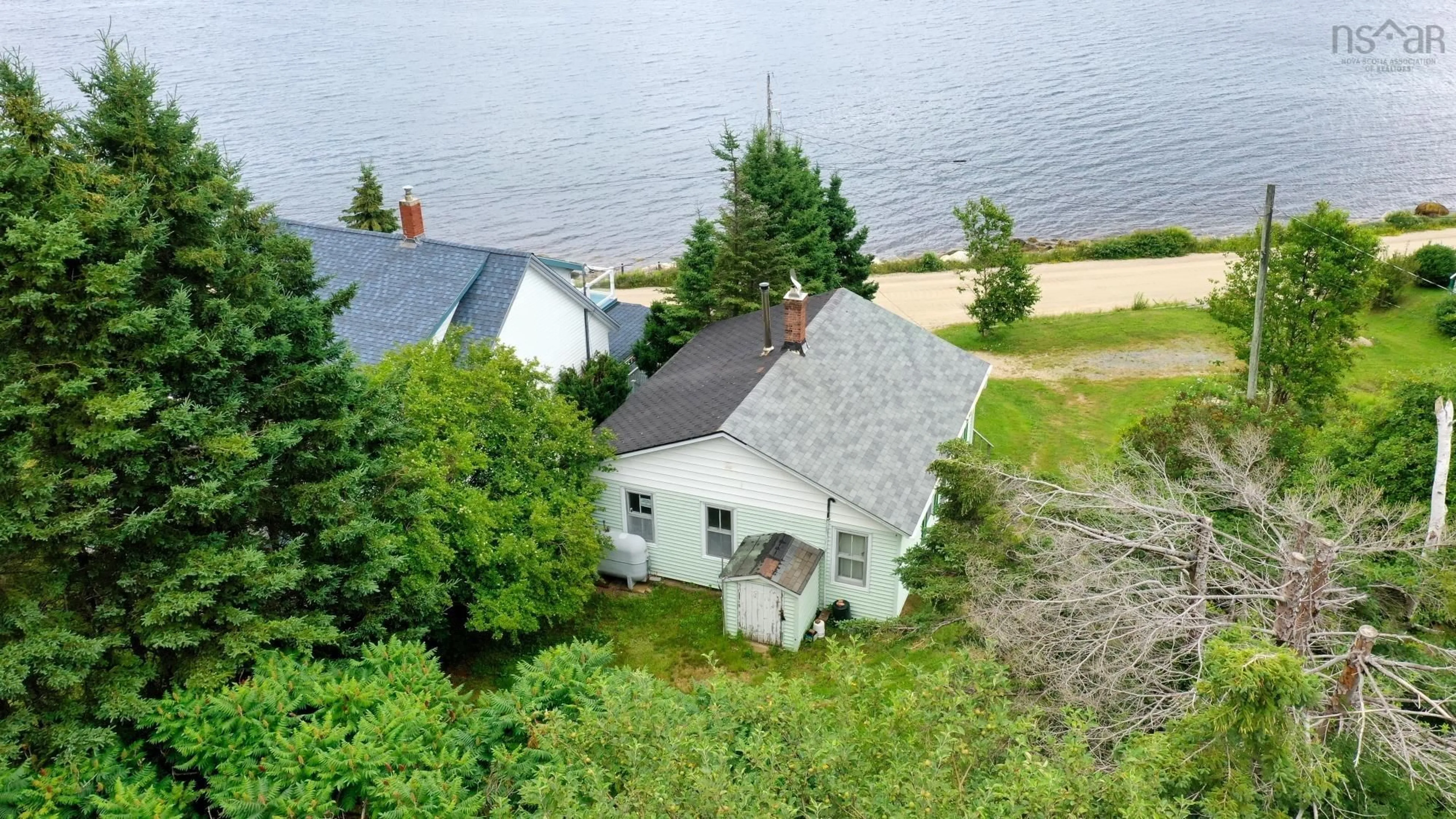 A pic from outside/outdoor area/front of a property/back of a property/a pic from drone, water/lake/river/ocean view for 462 Mill Cove Shore Road, Birchy Head Nova Scotia B0J 1T0