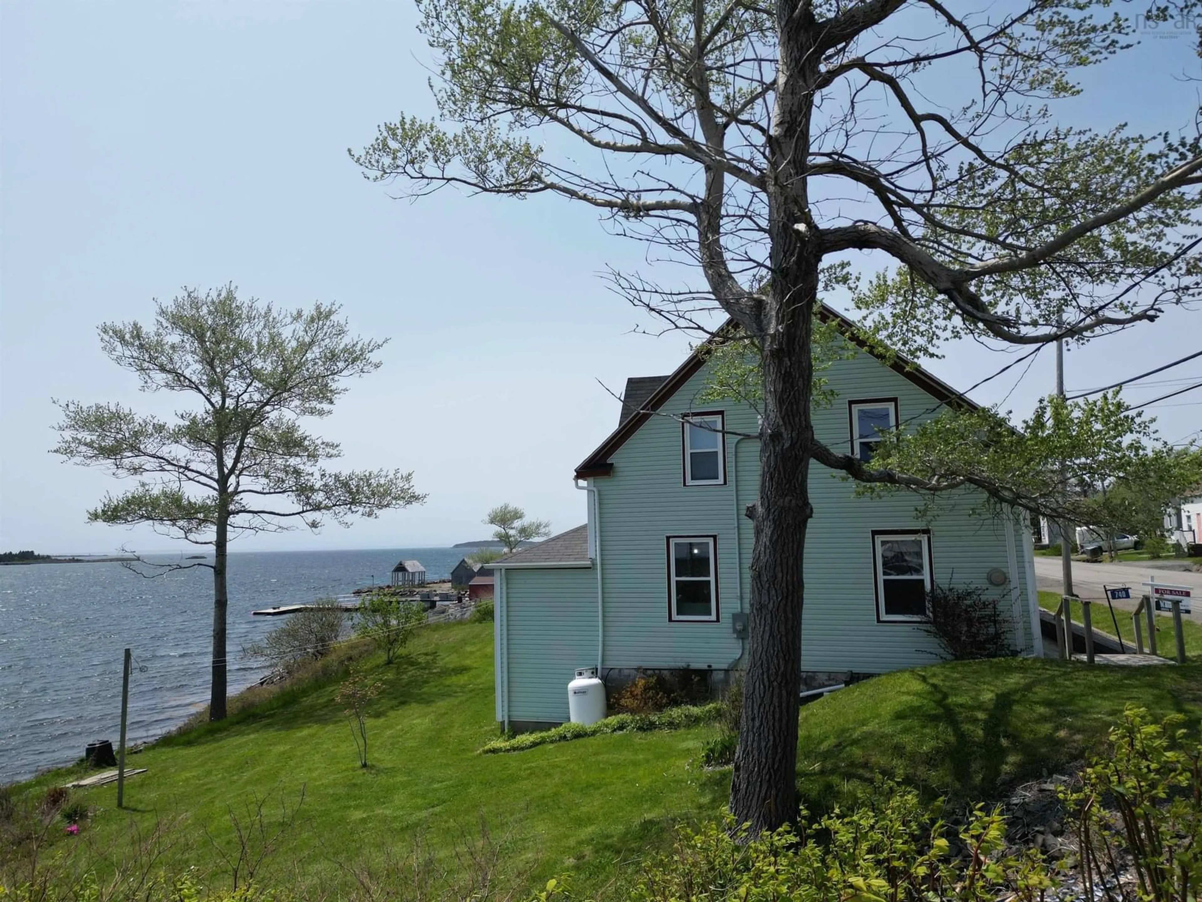 A pic from outside/outdoor area/front of a property/back of a property/a pic from drone, water/lake/river/ocean view for 740 Veterans Memorial Dr, Arichat Nova Scotia B0E 1A0