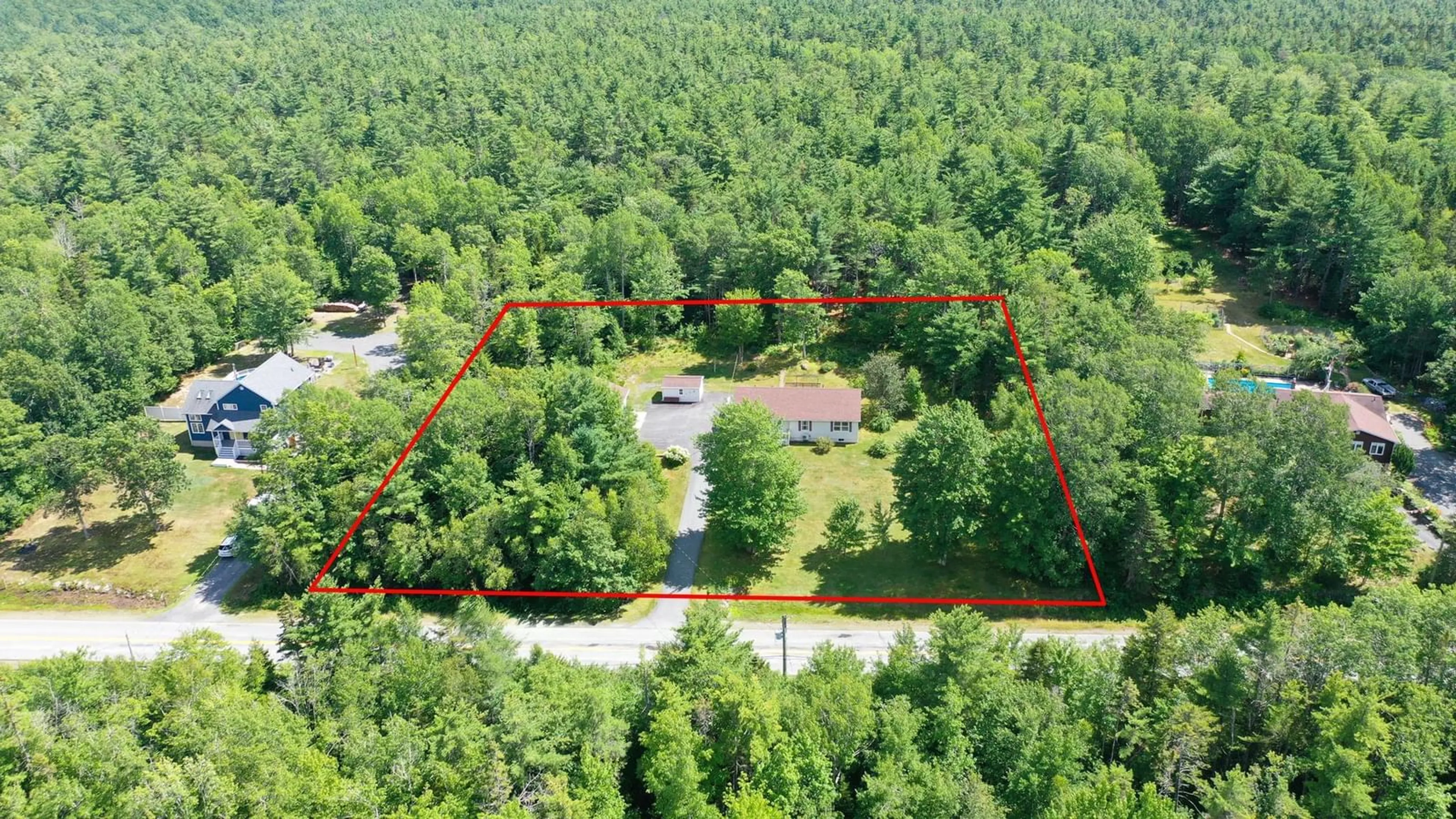A pic from outside/outdoor area/front of a property/back of a property/a pic from drone, forest/trees view for 120 331 Hwy, Mill Village Nova Scotia B0J 2H0
