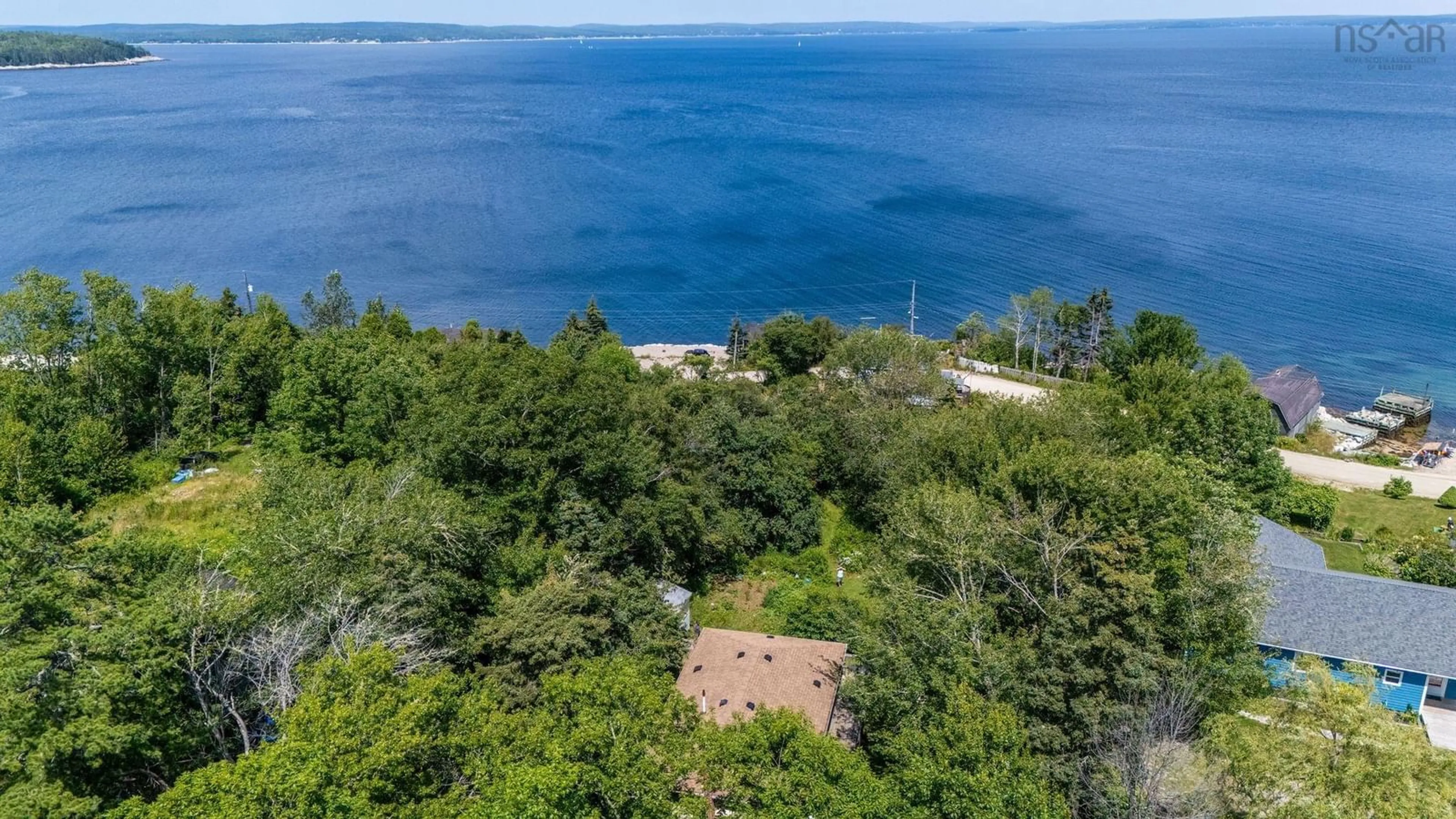 A pic from outside/outdoor area/front of a property/back of a property/a pic from drone, water/lake/river/ocean view for 1315 Highway 329, Mill Cove Nova Scotia B0J 1T0