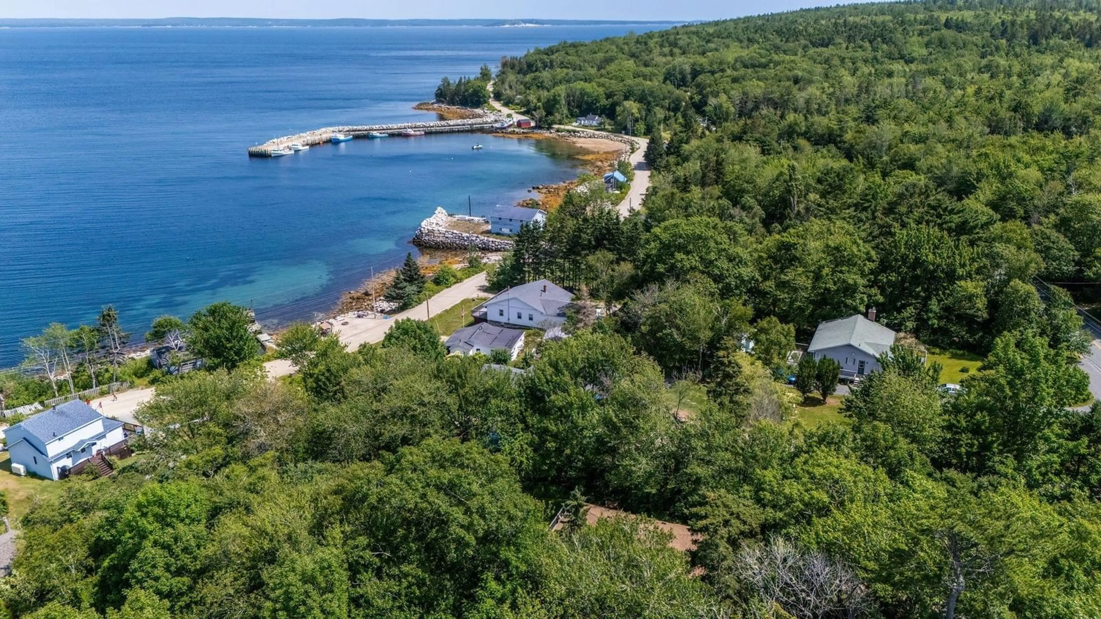 A pic from outside/outdoor area/front of a property/back of a property/a pic from drone, water/lake/river/ocean view for 1315 Highway 329, Mill Cove Nova Scotia B0J 1T0