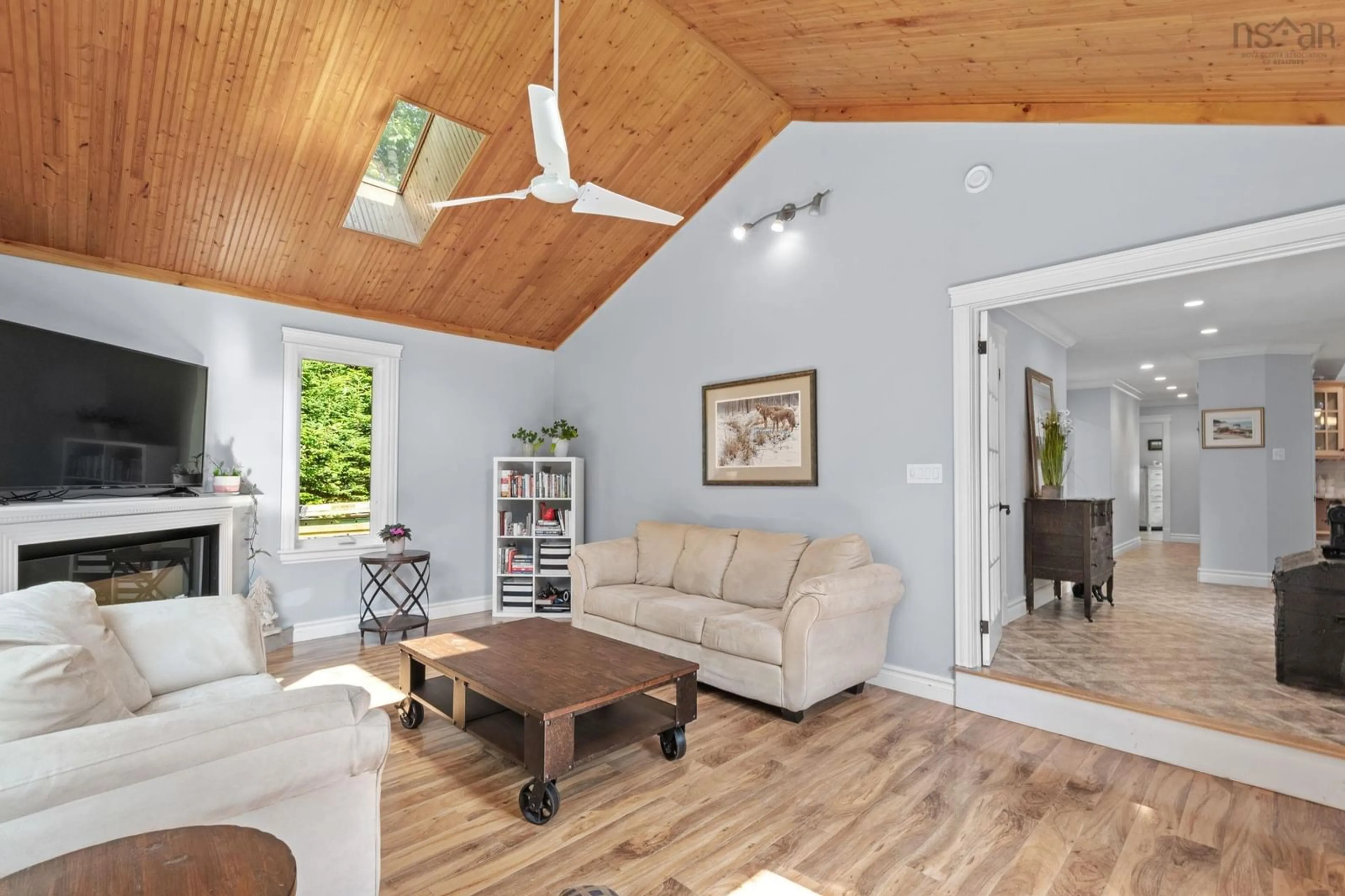 Living room with furniture, wood/laminate floor for 6 Spruce Lane, Boutiliers Point Nova Scotia B3Z 4G8