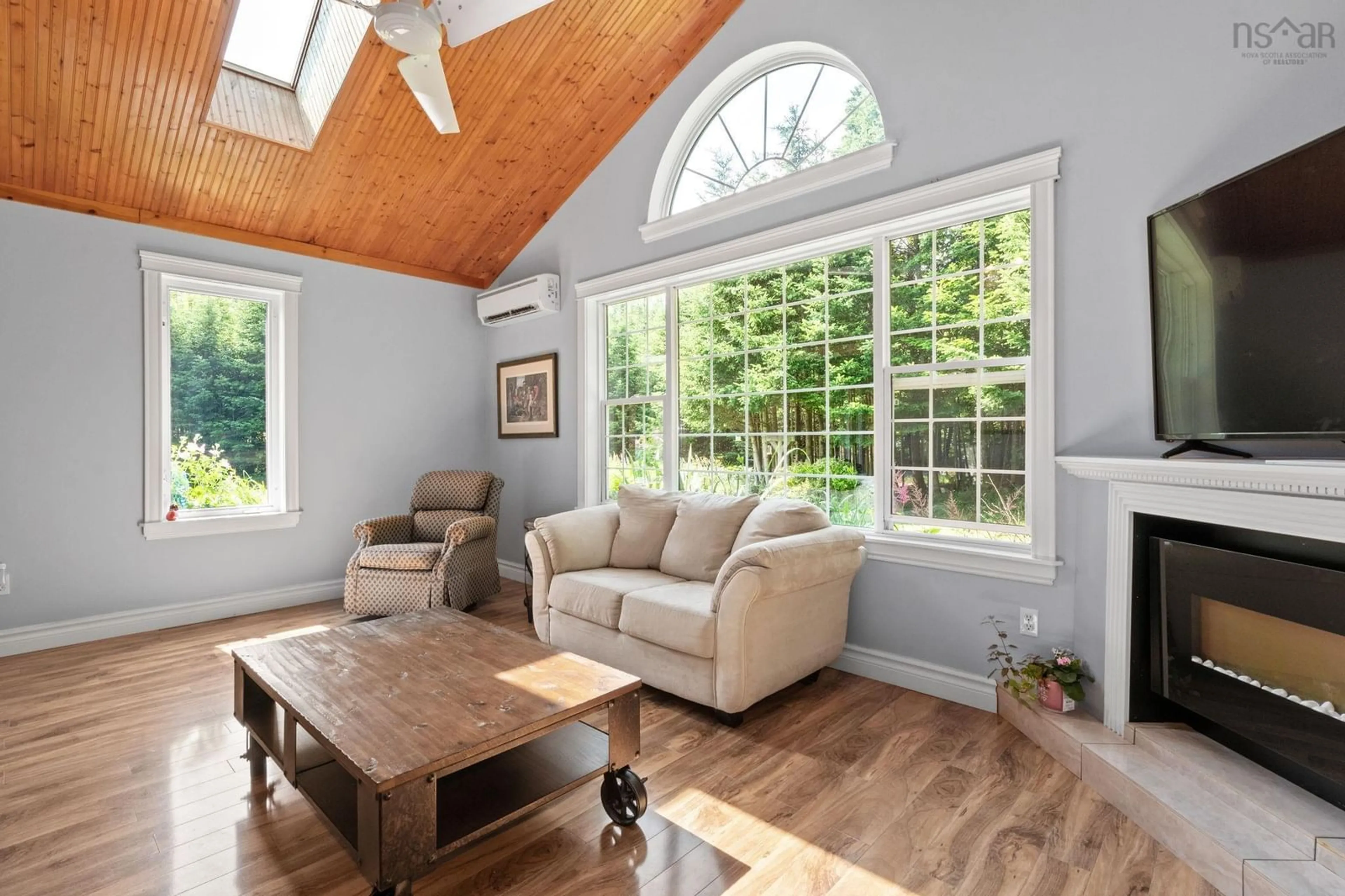 Living room with furniture, wood/laminate floor for 6 Spruce Lane, Boutiliers Point Nova Scotia B3Z 4G8