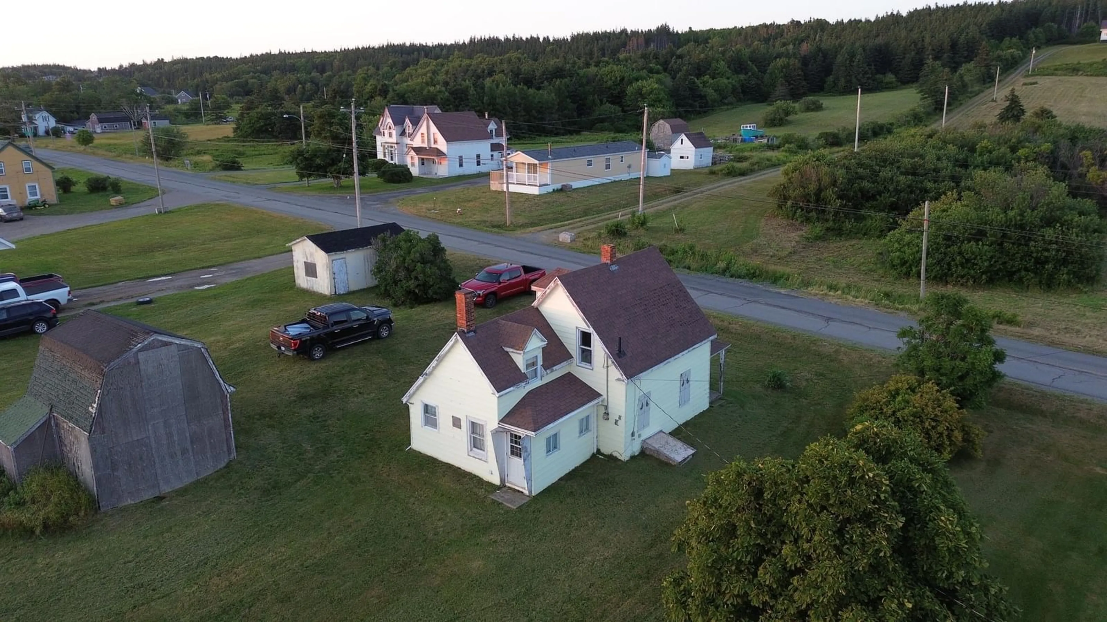 A pic from outside/outdoor area/front of a property/back of a property/a pic from drone, building for 411 Main St, Port Hood Nova Scotia B0E 2W0