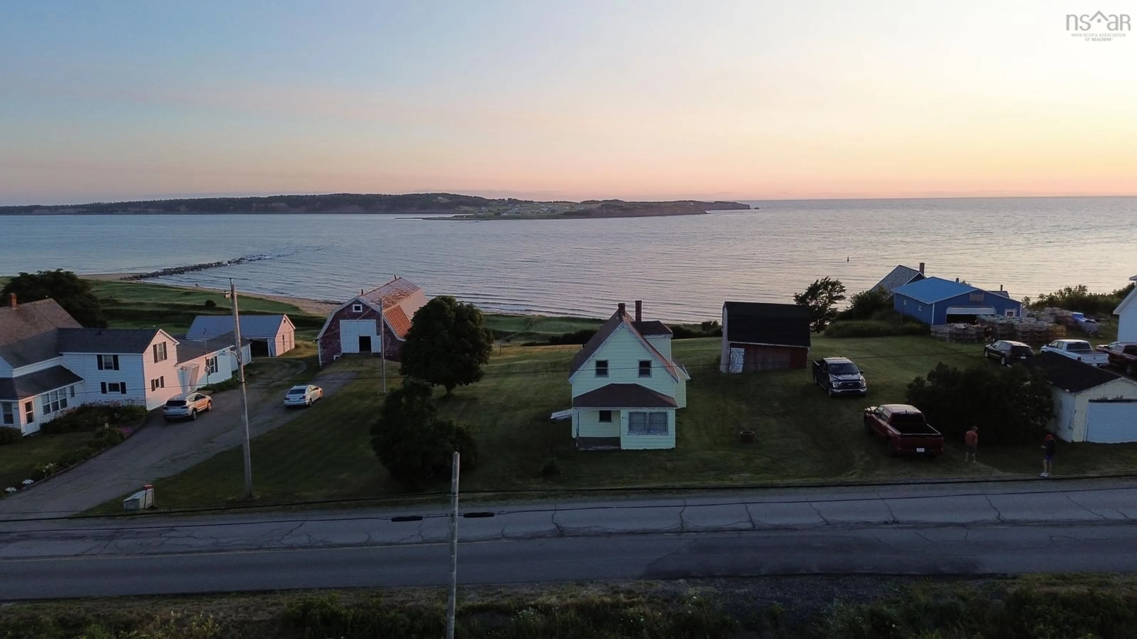 A pic from outside/outdoor area/front of a property/back of a property/a pic from drone, water/lake/river/ocean view for 411 Main St, Port Hood Nova Scotia B0E 2W0