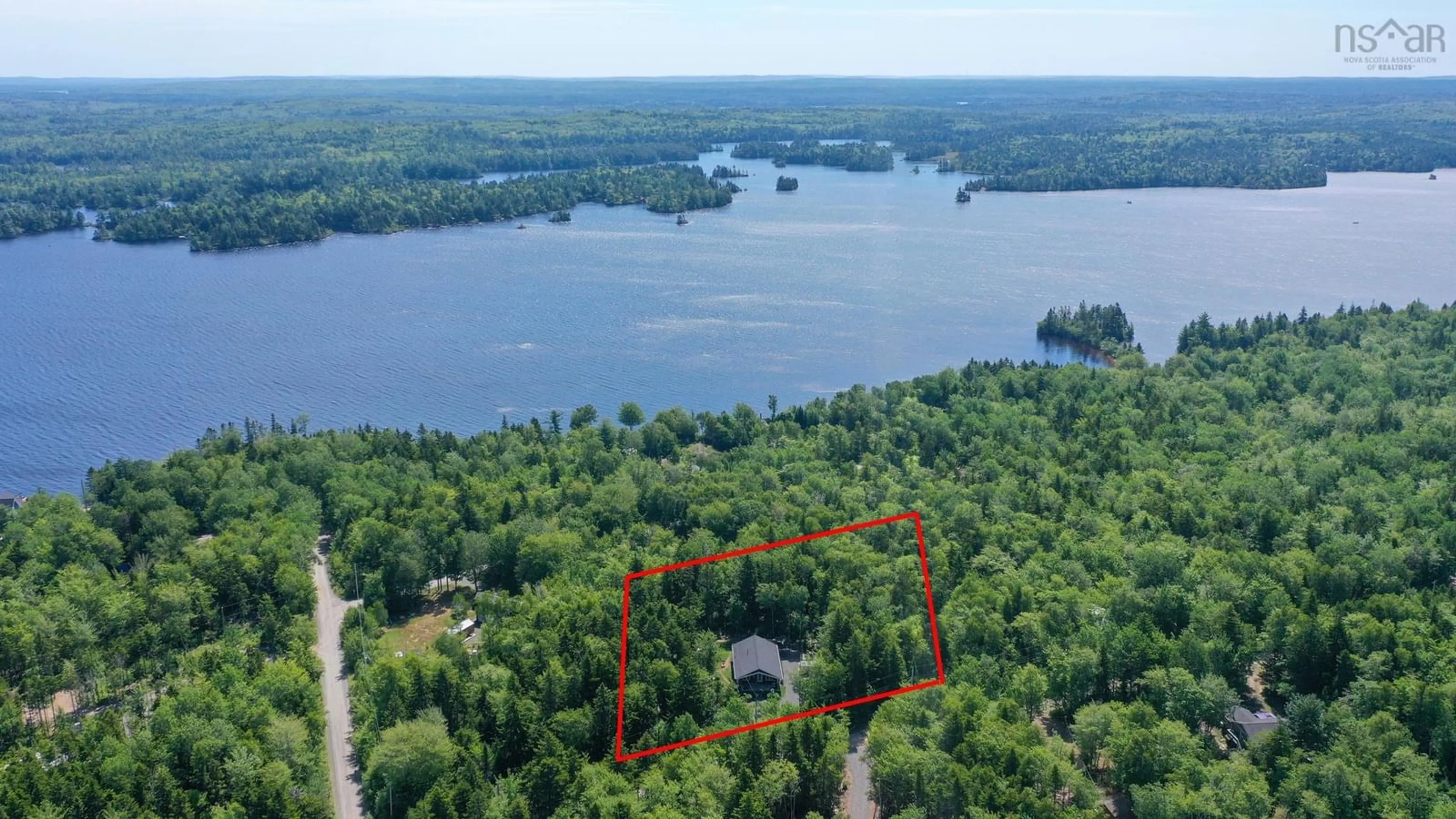 A pic from outside/outdoor area/front of a property/back of a property/a pic from drone, water/lake/river/ocean view for 17 Loon Lane, Aylesford Lake Nova Scotia B0P 1C0