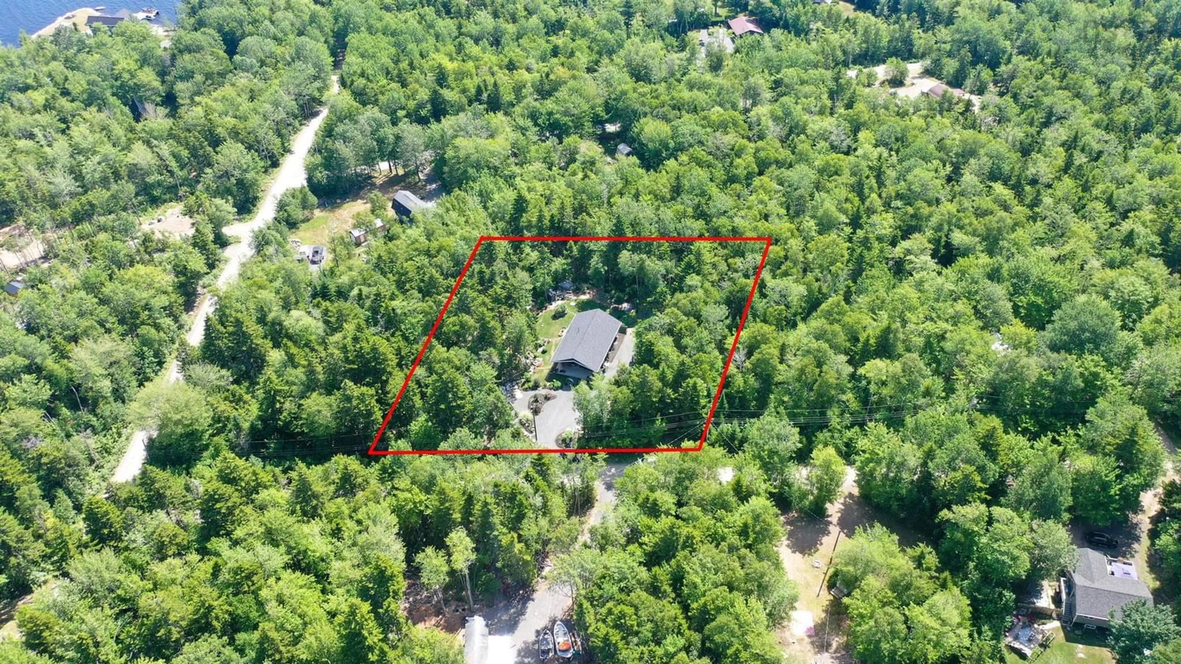 A pic from outside/outdoor area/front of a property/back of a property/a pic from drone, forest/trees view for 17 Loon Lane, Aylesford Lake Nova Scotia B0P 1C0