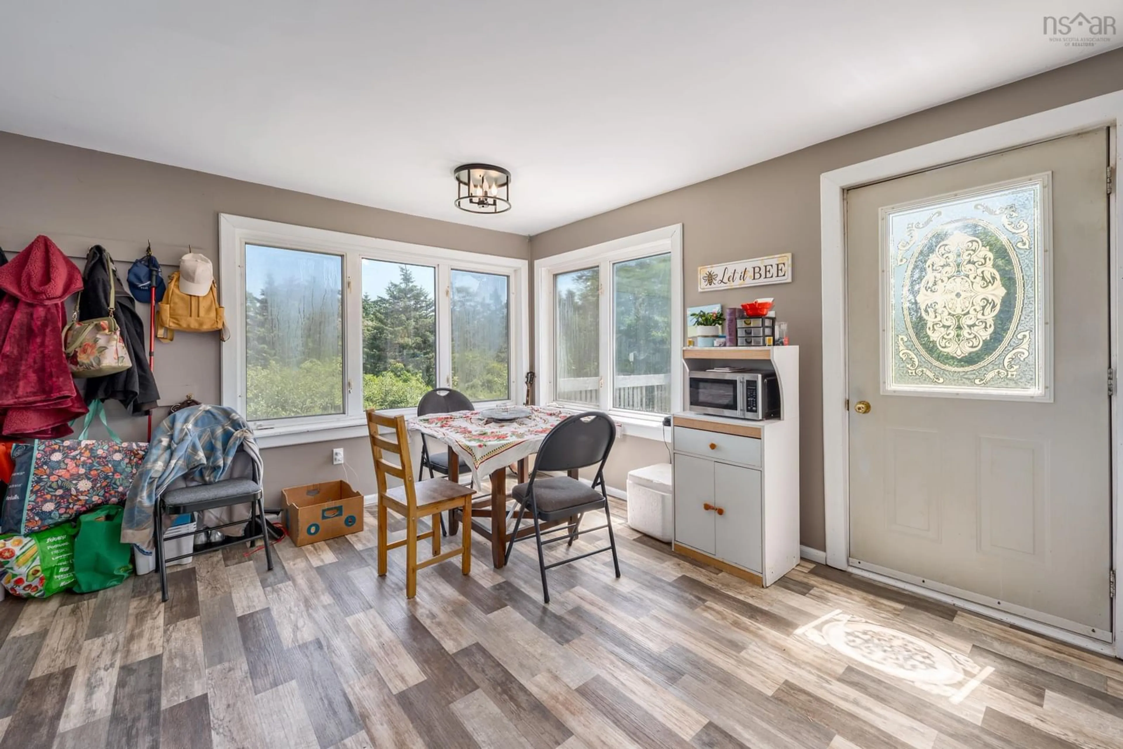 Open concept kitchen, wood/laminate floor for 47 Golden Glow Lane, Little River Harbour Nova Scotia B0W 1B0