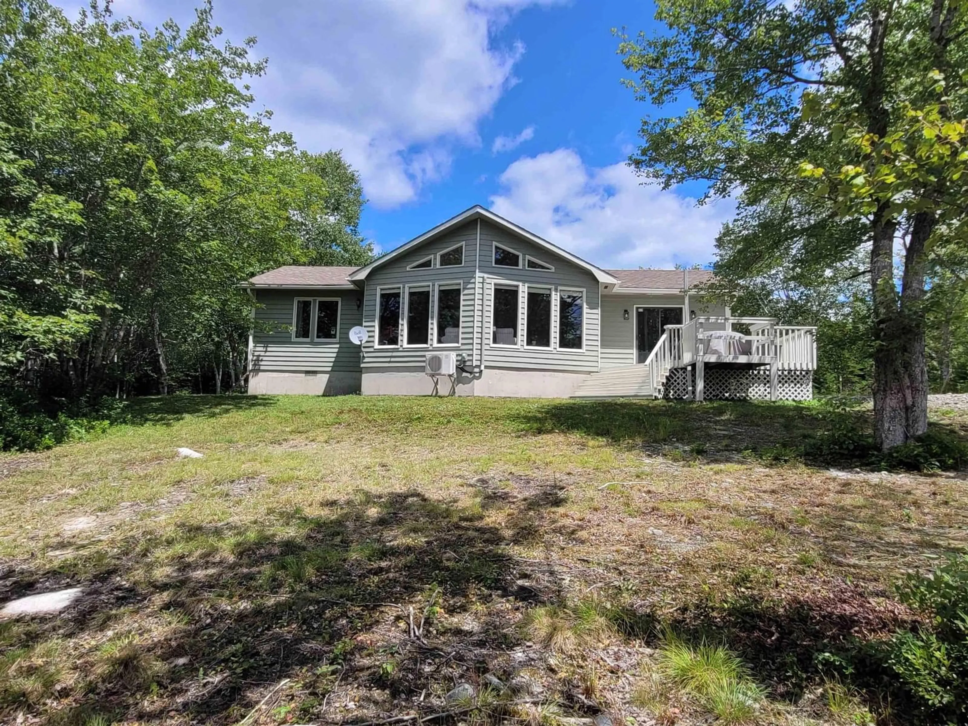 A pic from outside/outdoor area/front of a property/back of a property/a pic from drone, water/lake/river/ocean view for 57 Somerset Dr, East Sable River Nova Scotia B0T 1V0