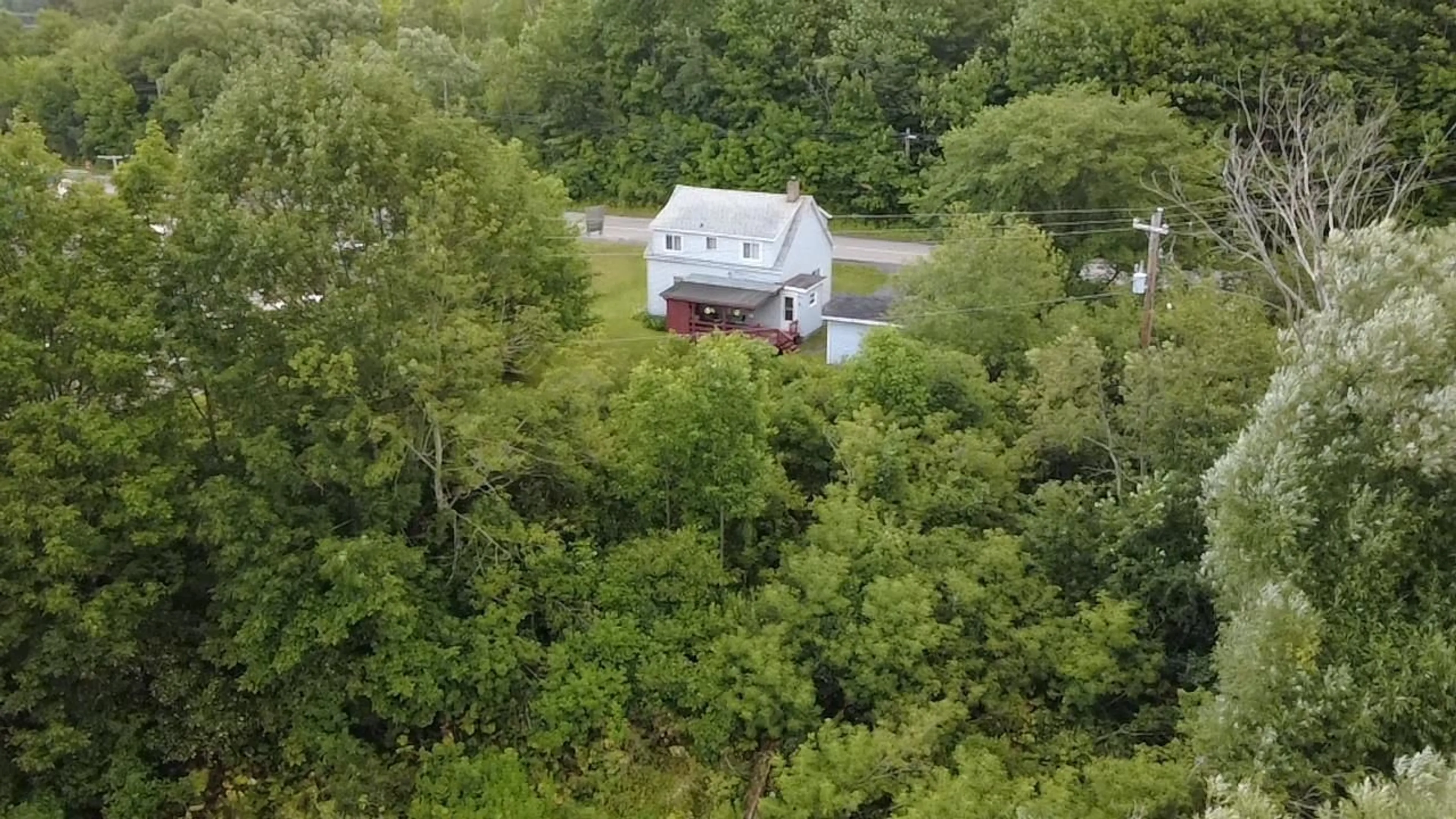 A pic from outside/outdoor area/front of a property/back of a property/a pic from drone, forest/trees view for 5047 East River East Side Rd, Plymouth Nova Scotia B2H 5C5