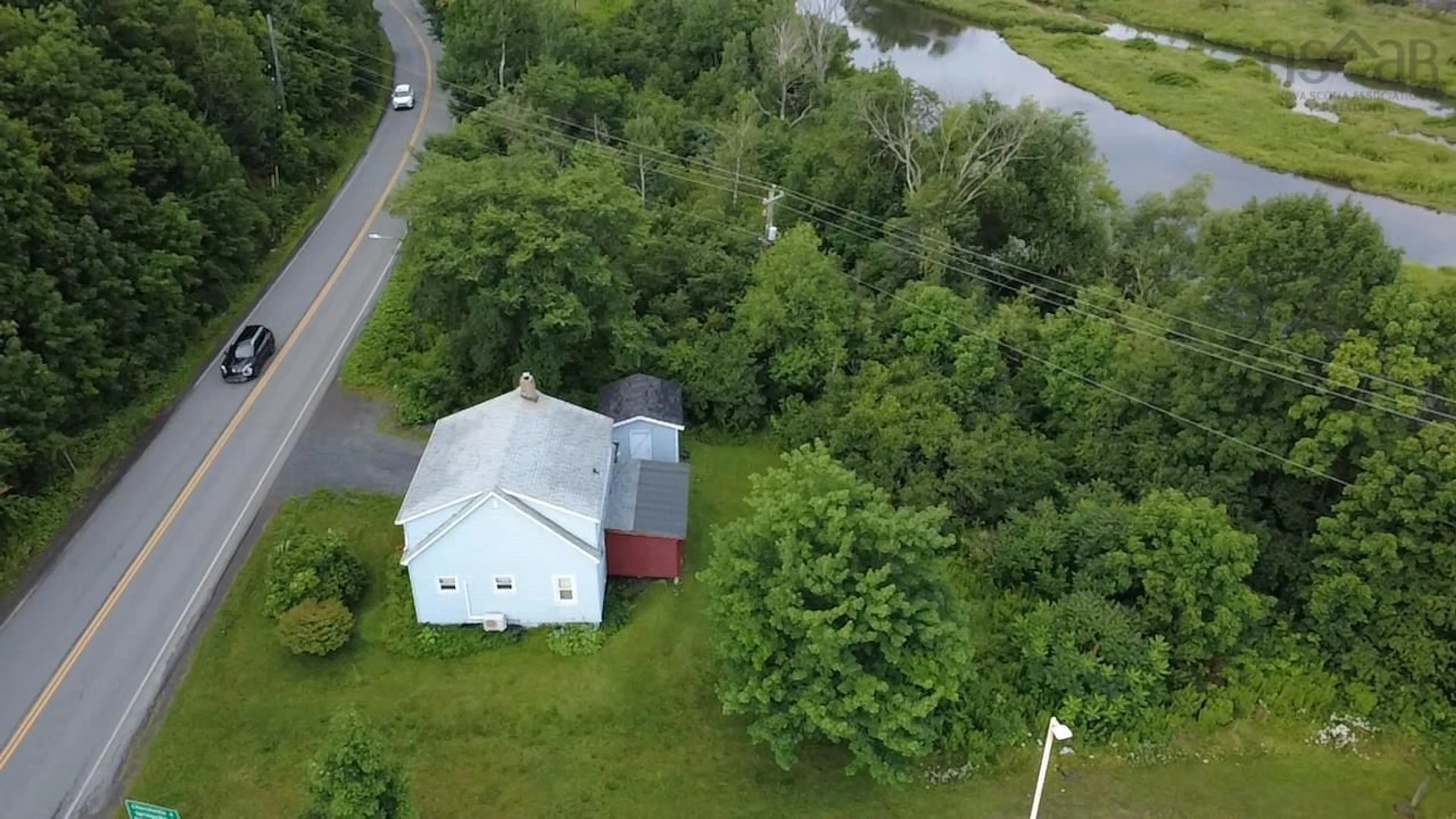 A pic from outside/outdoor area/front of a property/back of a property/a pic from drone, water/lake/river/ocean view for 5047 East River East Side Rd, Plymouth Nova Scotia B2H 5C5