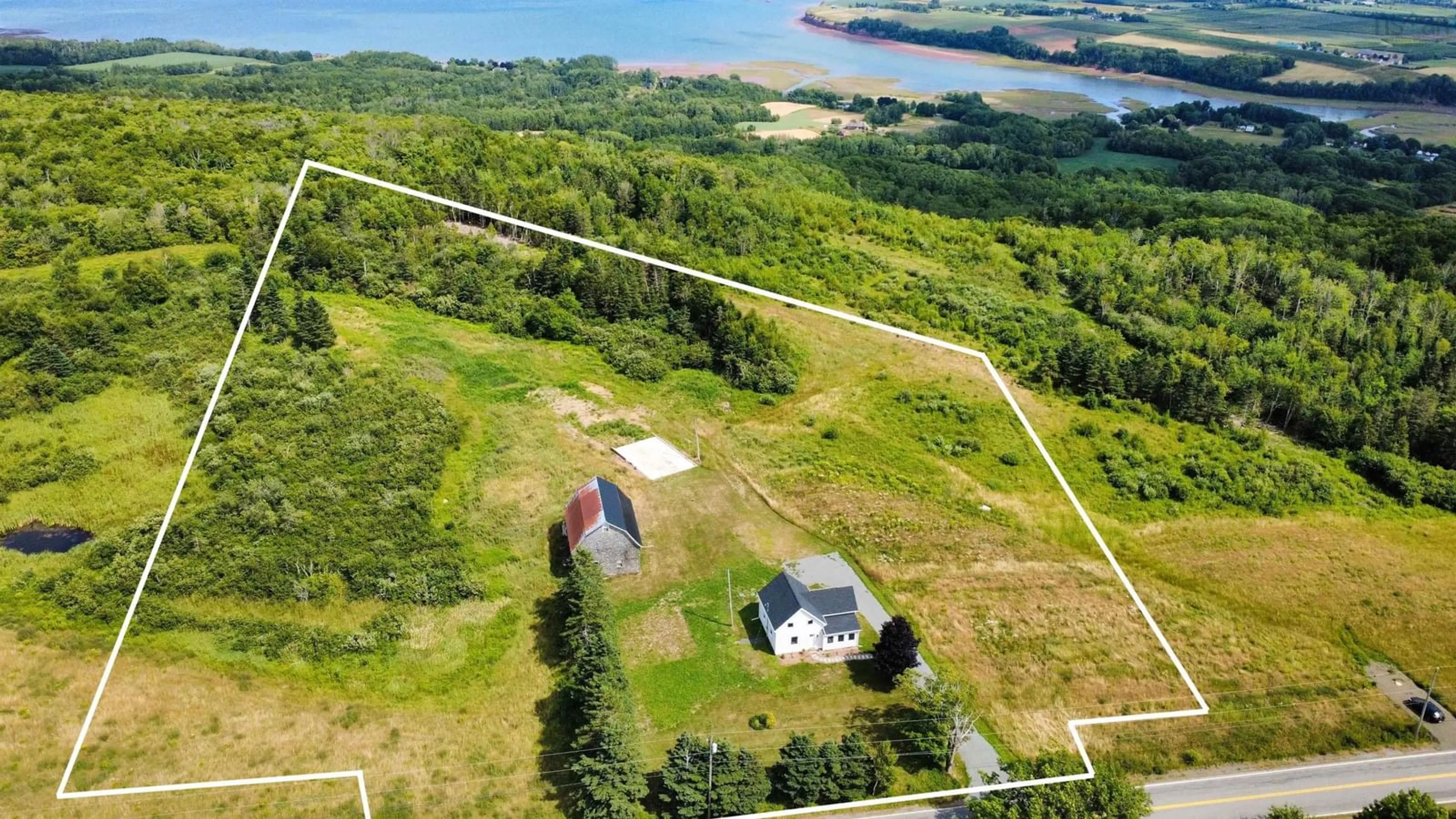 A pic from outside/outdoor area/front of a property/back of a property/a pic from drone, water/lake/river/ocean view for 3610 Highway 358, South Scots Bay Nova Scotia B0P 1H0