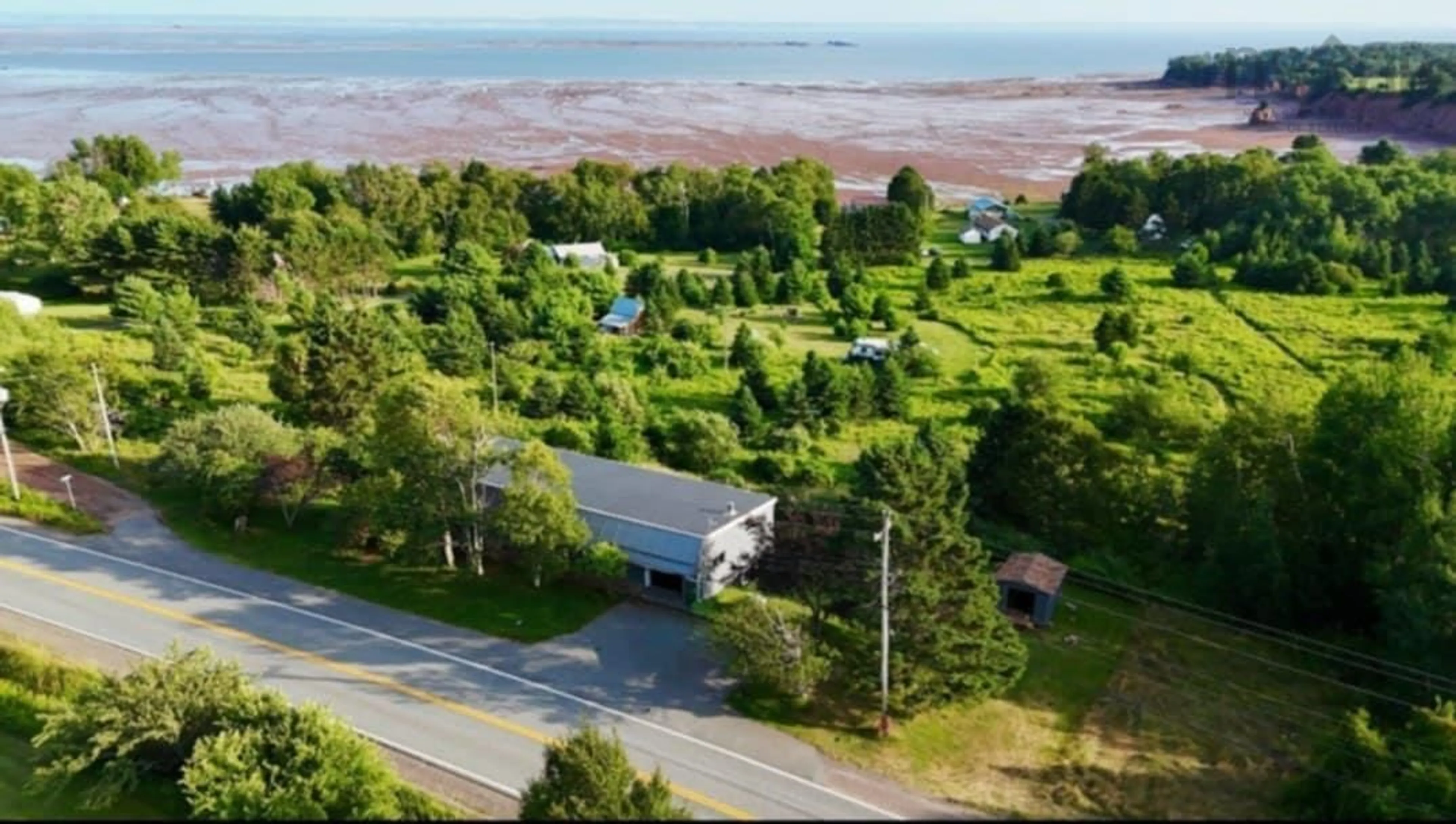 A pic from outside/outdoor area/front of a property/back of a property/a pic from drone, water/lake/river/ocean view for 1994 Highway 2, Economy Nova Scotia B0M 1B0