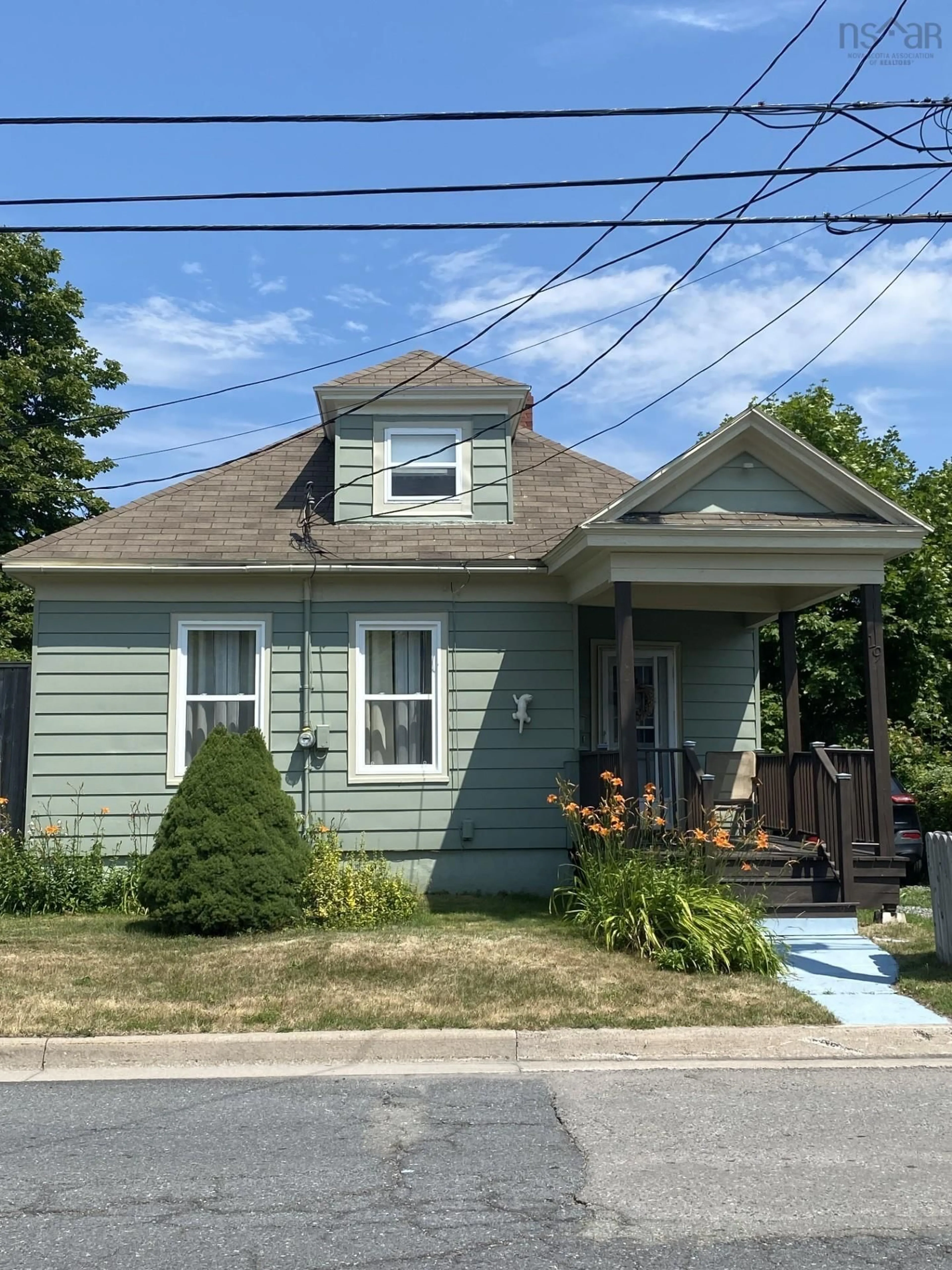 Home with vinyl exterior material, street for 19 Regent St, North Sydney Nova Scotia B2A 2E3