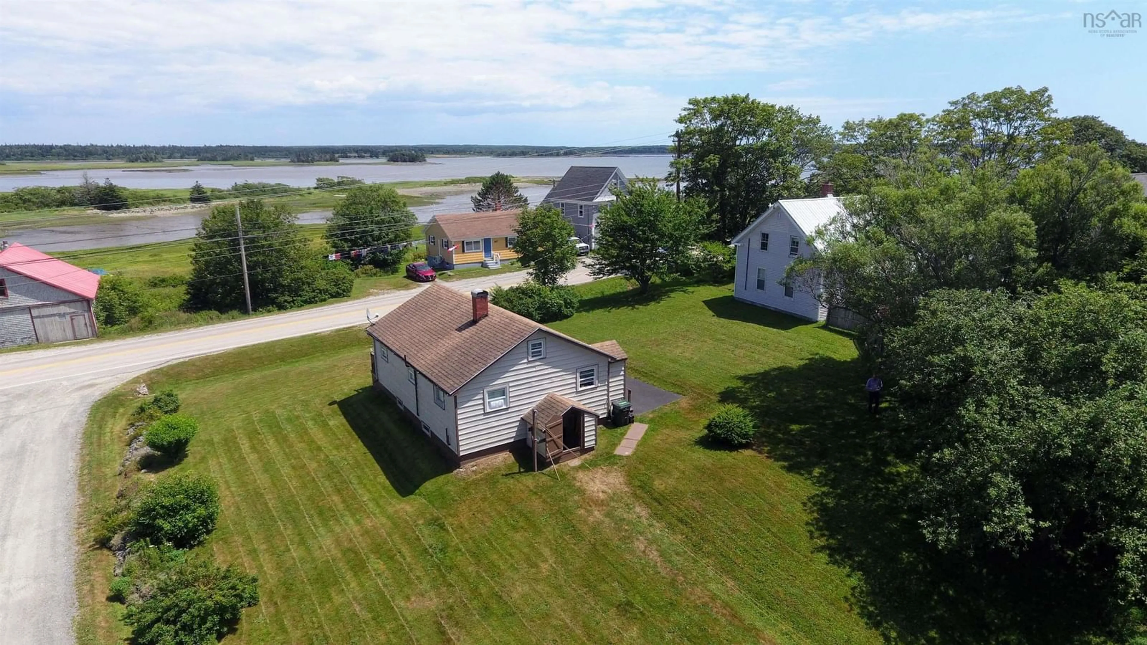 A pic from outside/outdoor area/front of a property/back of a property/a pic from drone, water/lake/river/ocean view for 504 Highway 335,, West Pubnico Nova Scotia B0W 3S0