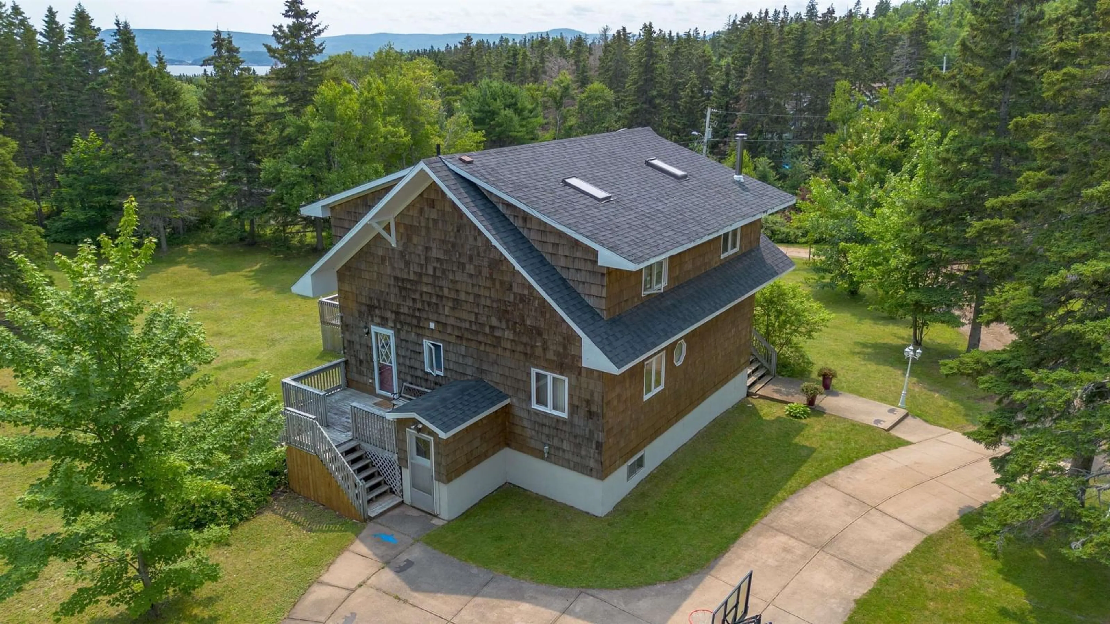 A pic from outside/outdoor area/front of a property/back of a property/a pic from drone, building for 35679 Cabot Trail, Ingonish Nova Scotia B0C 1K0