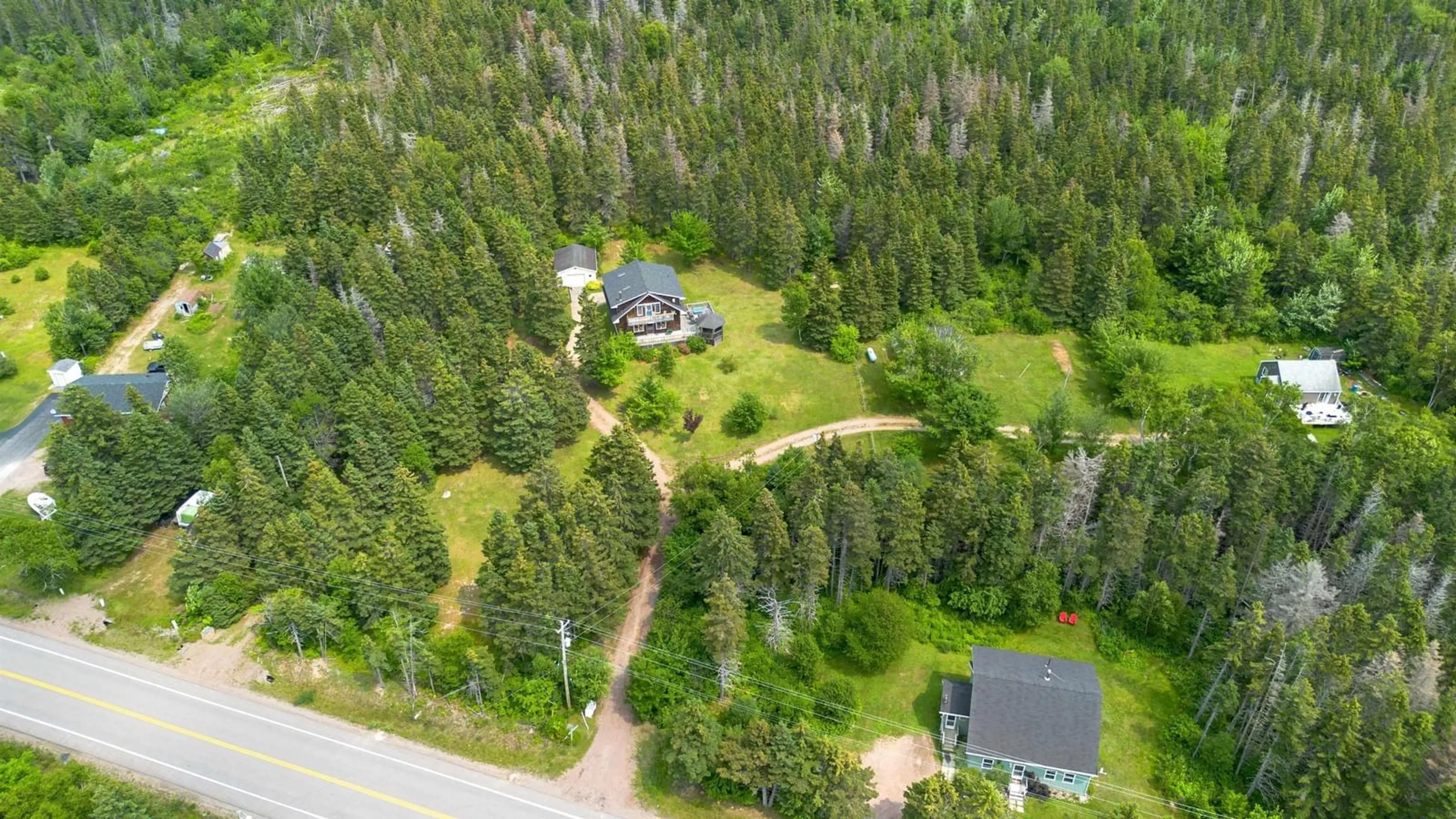 A pic from outside/outdoor area/front of a property/back of a property/a pic from drone, forest/trees view for 35679 Cabot Trail, Ingonish Nova Scotia B0C 1K0