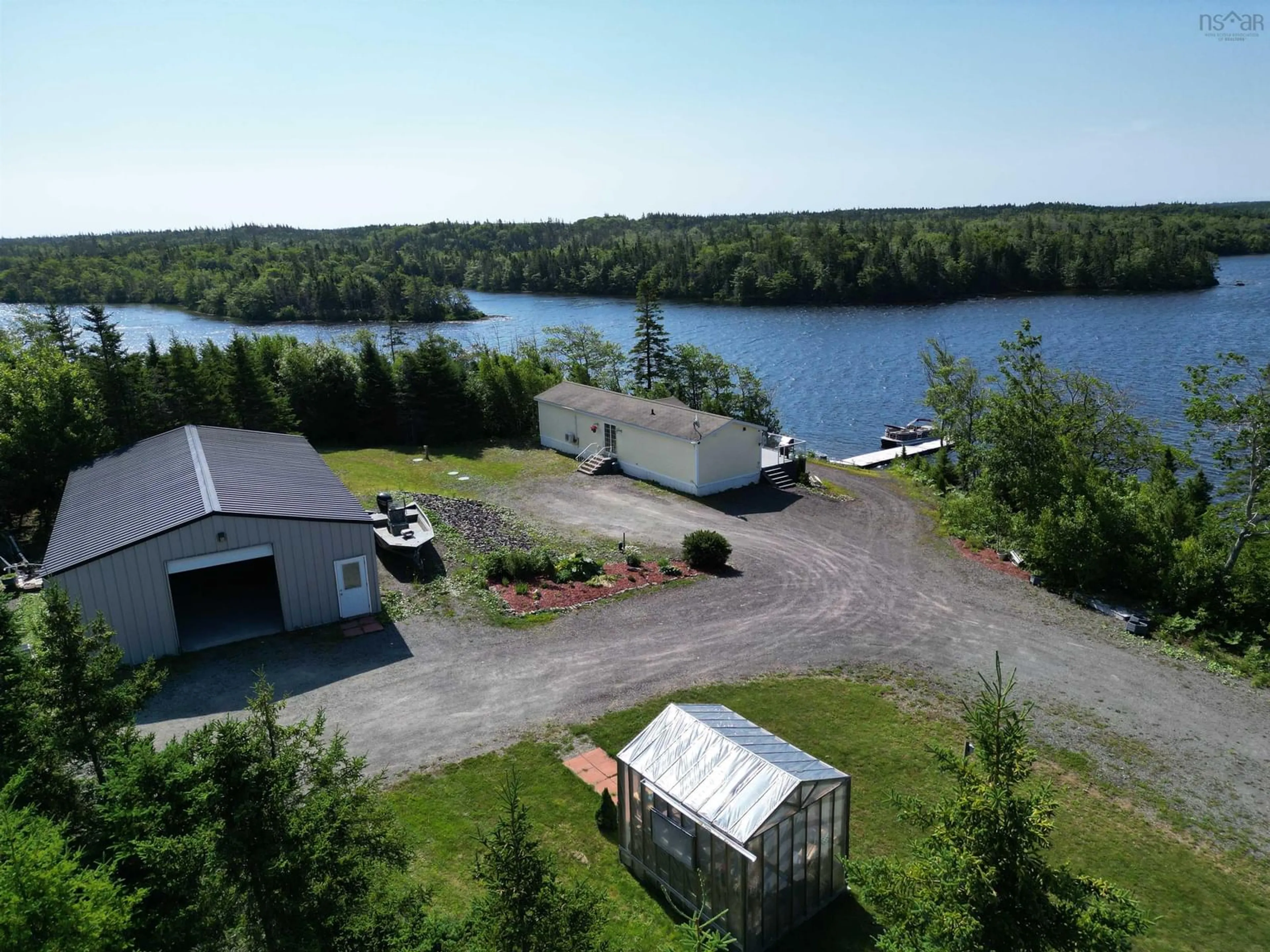 A pic from outside/outdoor area/front of a property/back of a property/a pic from drone, water/lake/river/ocean view for 205 Brodies Rd., D'Escousse Nova Scotia B0E 1K0