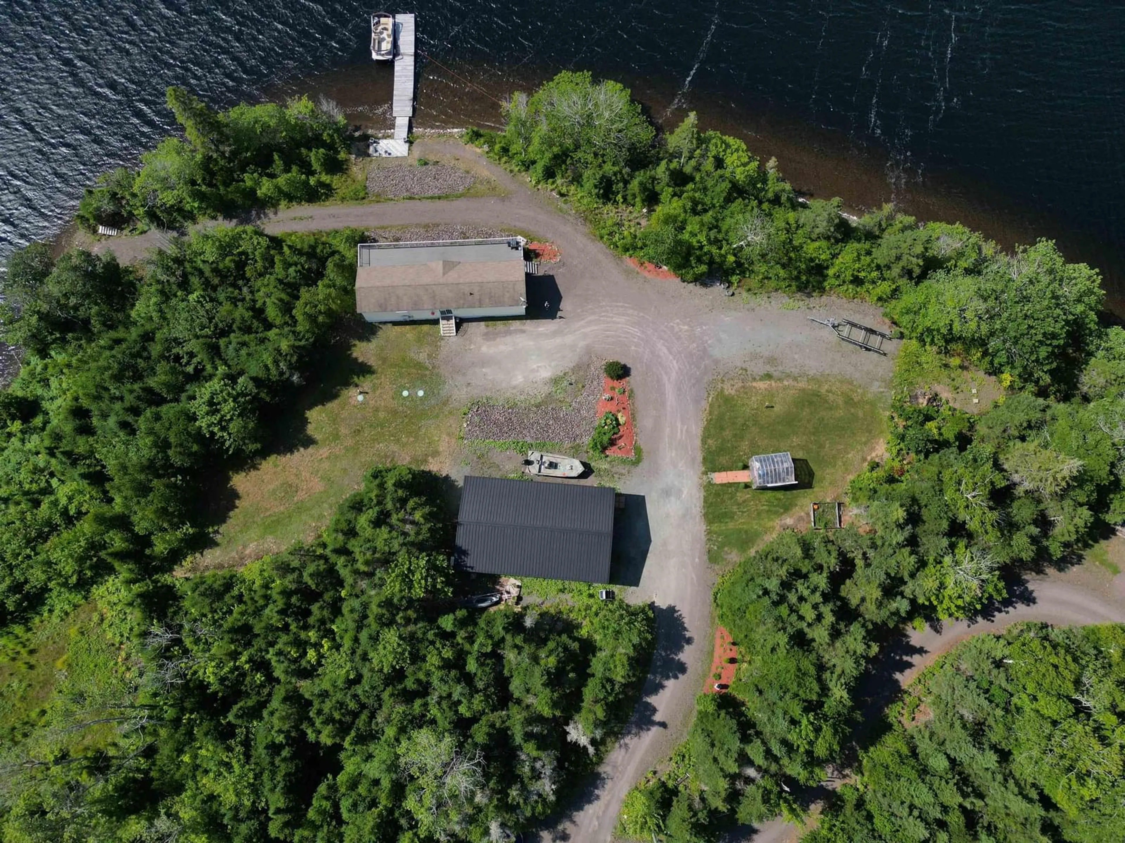A pic from outside/outdoor area/front of a property/back of a property/a pic from drone, water/lake/river/ocean view for 205 Brodies Rd., D'Escousse Nova Scotia B0E 1K0
