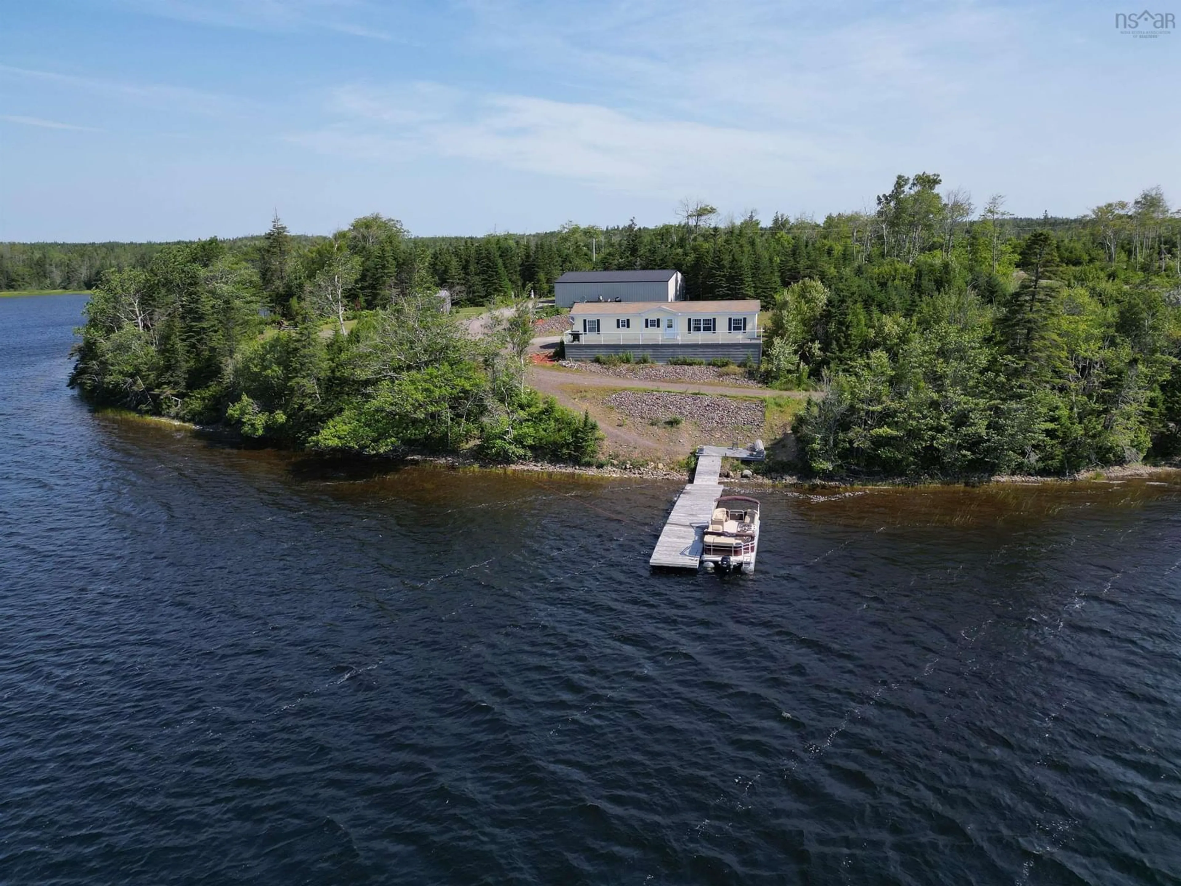 A pic from outside/outdoor area/front of a property/back of a property/a pic from drone, water/lake/river/ocean view for 205 Brodies Rd., D'Escousse Nova Scotia B0E 1K0