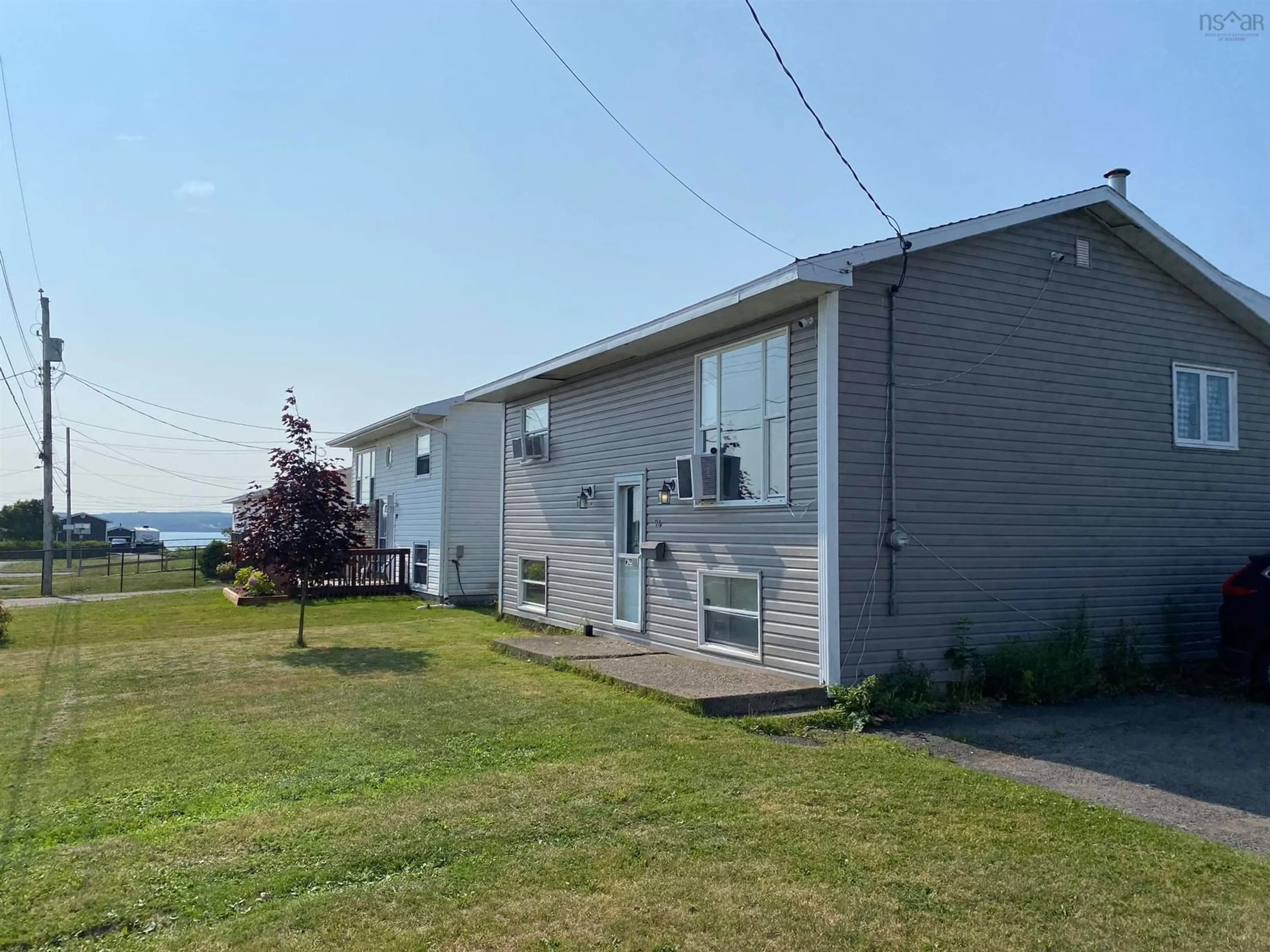 A pic from outside/outdoor area/front of a property/back of a property/a pic from drone, unknown for 24 Notre Dame St, Sydney Mines Nova Scotia B1V 2R7