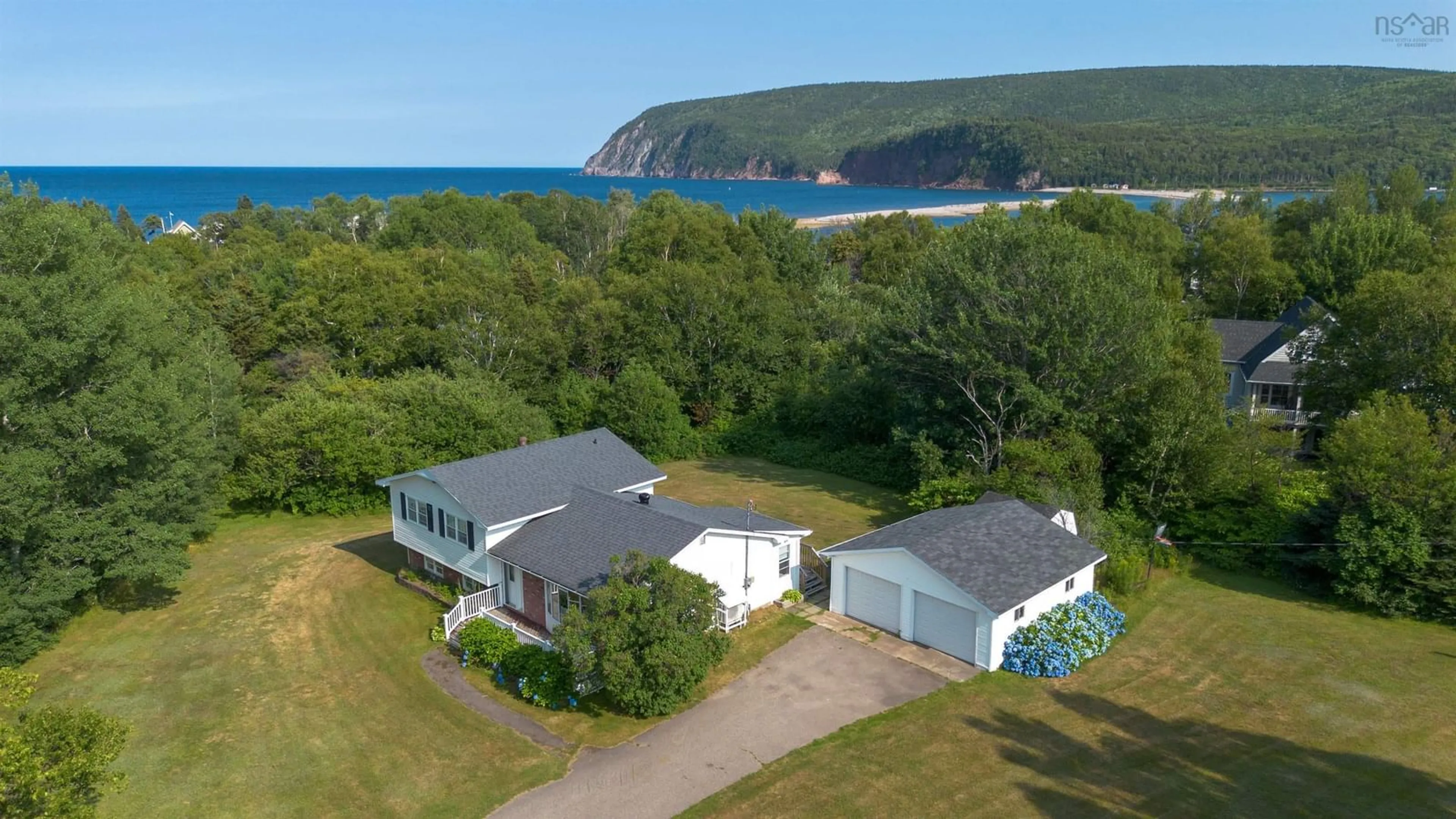A pic from outside/outdoor area/front of a property/back of a property/a pic from drone, water/lake/river/ocean view for 108 Beach Crossing Rd, Ingonish Beach Nova Scotia B0C 1K0