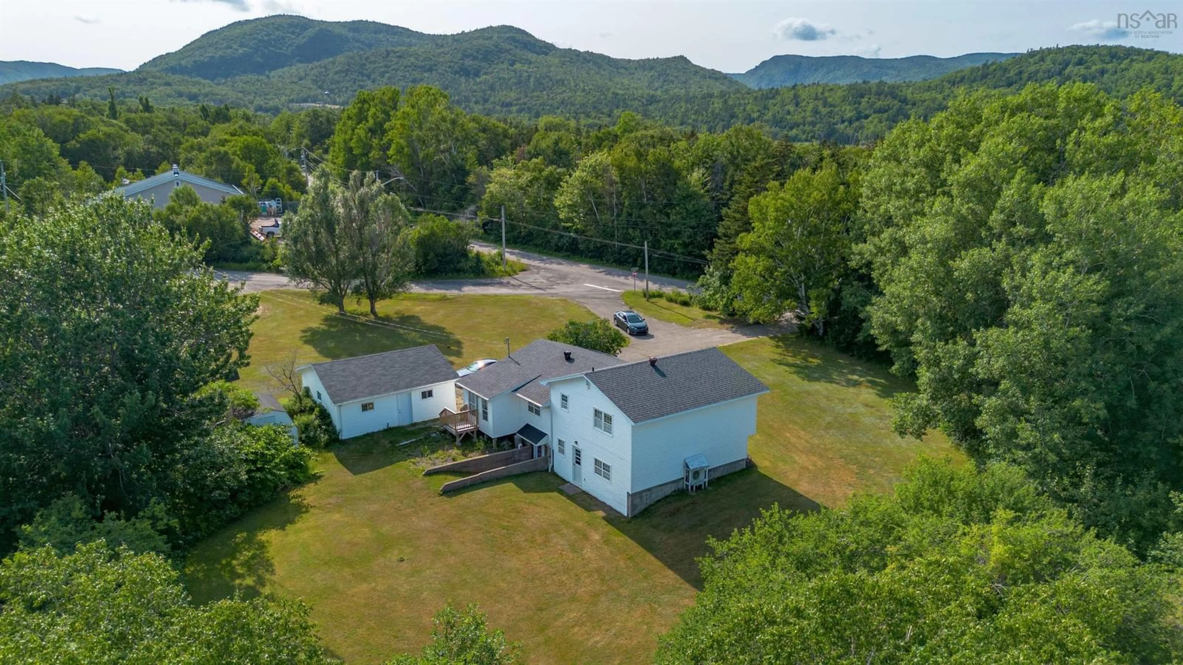 A pic from outside/outdoor area/front of a property/back of a property/a pic from drone, mountain view for 108 Beach Crossing Rd, Ingonish Beach Nova Scotia B0C 1K0