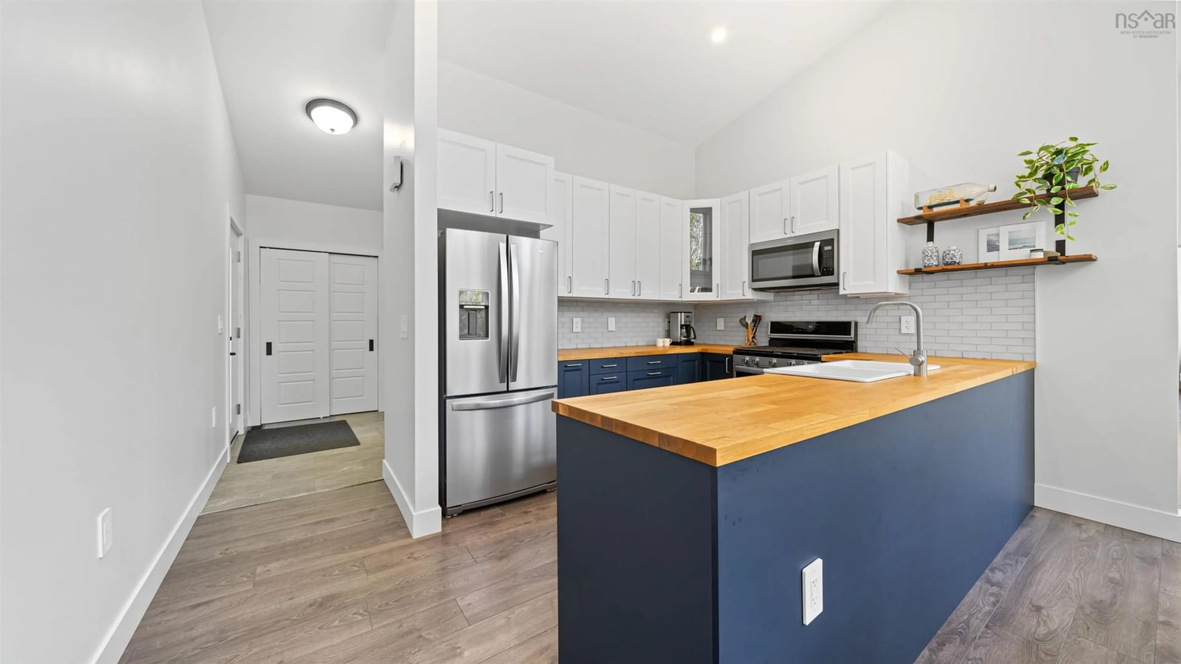 Open concept kitchen, wood/laminate floor for 7 Spyglass Way, White Point Nova Scotia B4B 0B7
