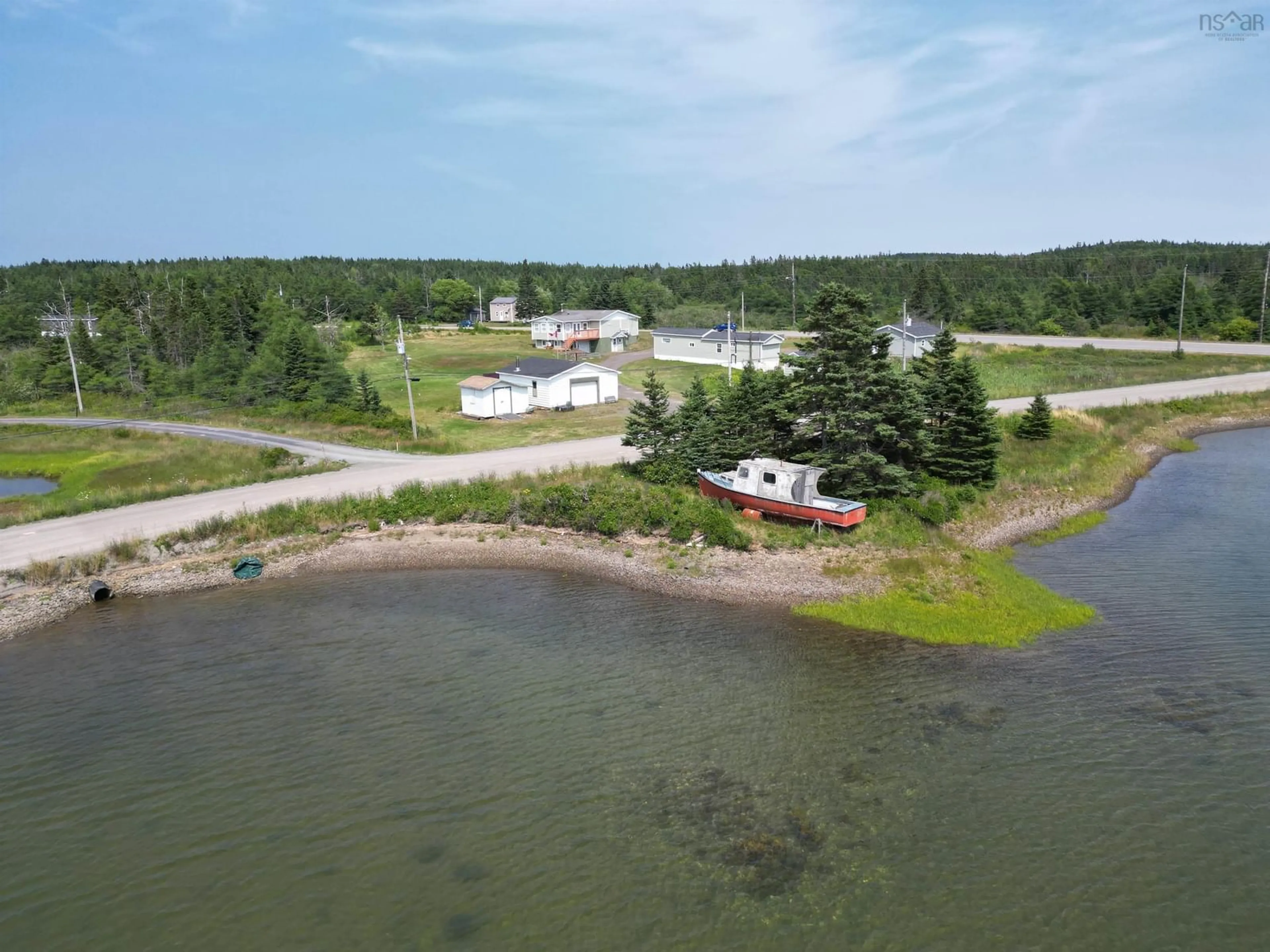 A pic from outside/outdoor area/front of a property/back of a property/a pic from drone, water/lake/river/ocean view for 1184 Highway 206, West Arichat Nova Scotia B0E 3J0