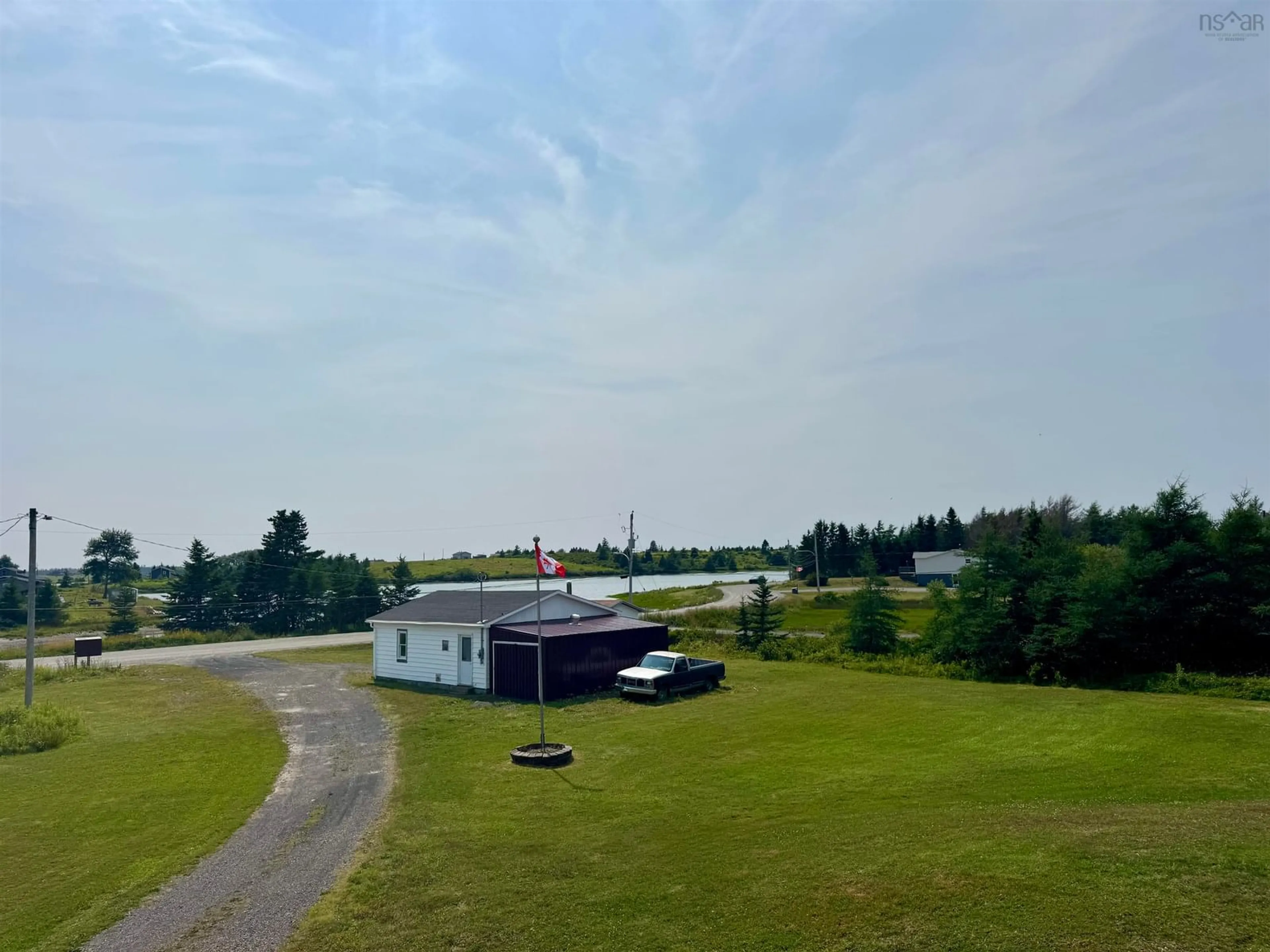 A pic from outside/outdoor area/front of a property/back of a property/a pic from drone, unknown for 1184 Highway 206, West Arichat Nova Scotia B0E 3J0