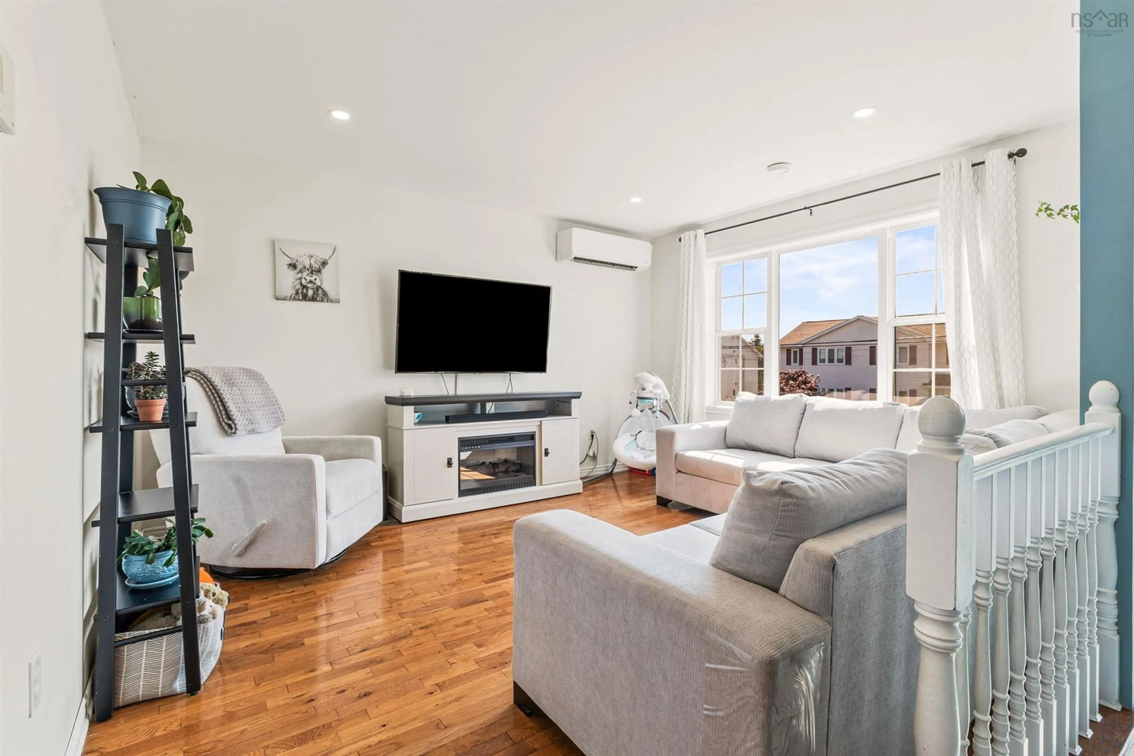 Living room with furniture, wood/laminate floor for 182 Melrose Cres, Eastern Passage Nova Scotia B3G 1P2