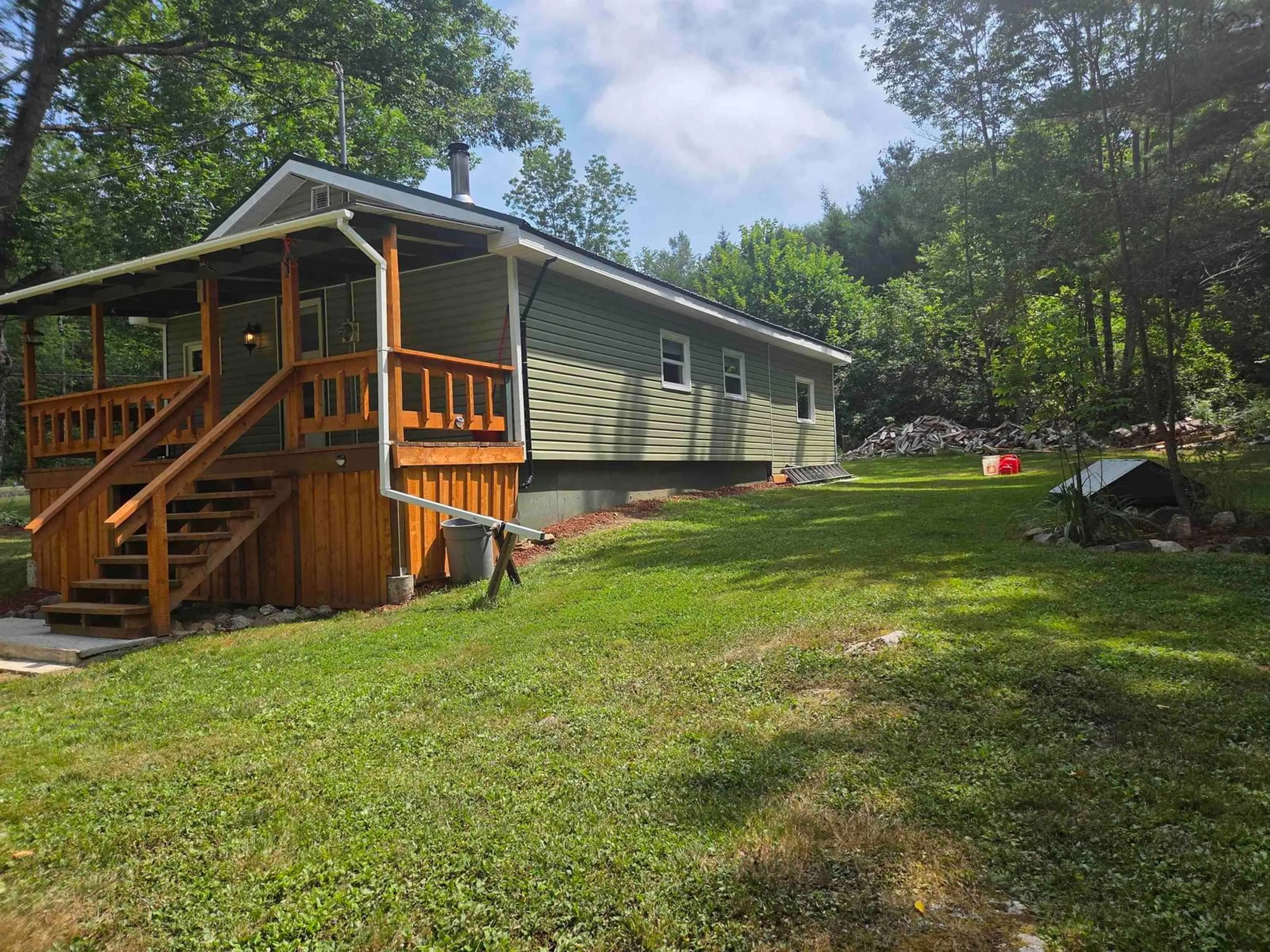 A pic from outside/outdoor area/front of a property/back of a property/a pic from drone, water/lake/river/ocean view for 40 Jefferson Road, Bear River East Nova Scotia B0S 1B0