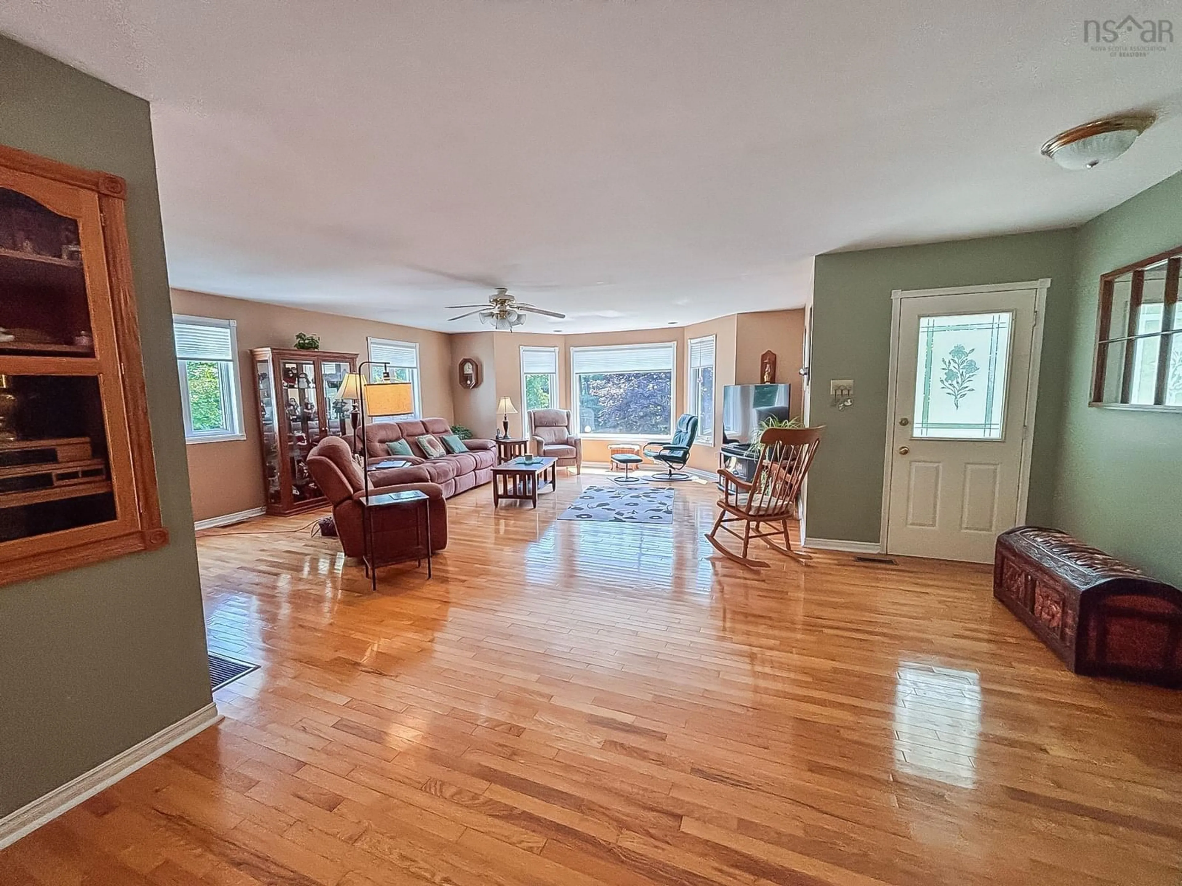 Living room with furniture, wood/laminate floor for 12970 Highway 3, Rhodes Corner Nova Scotia B4V 5N3