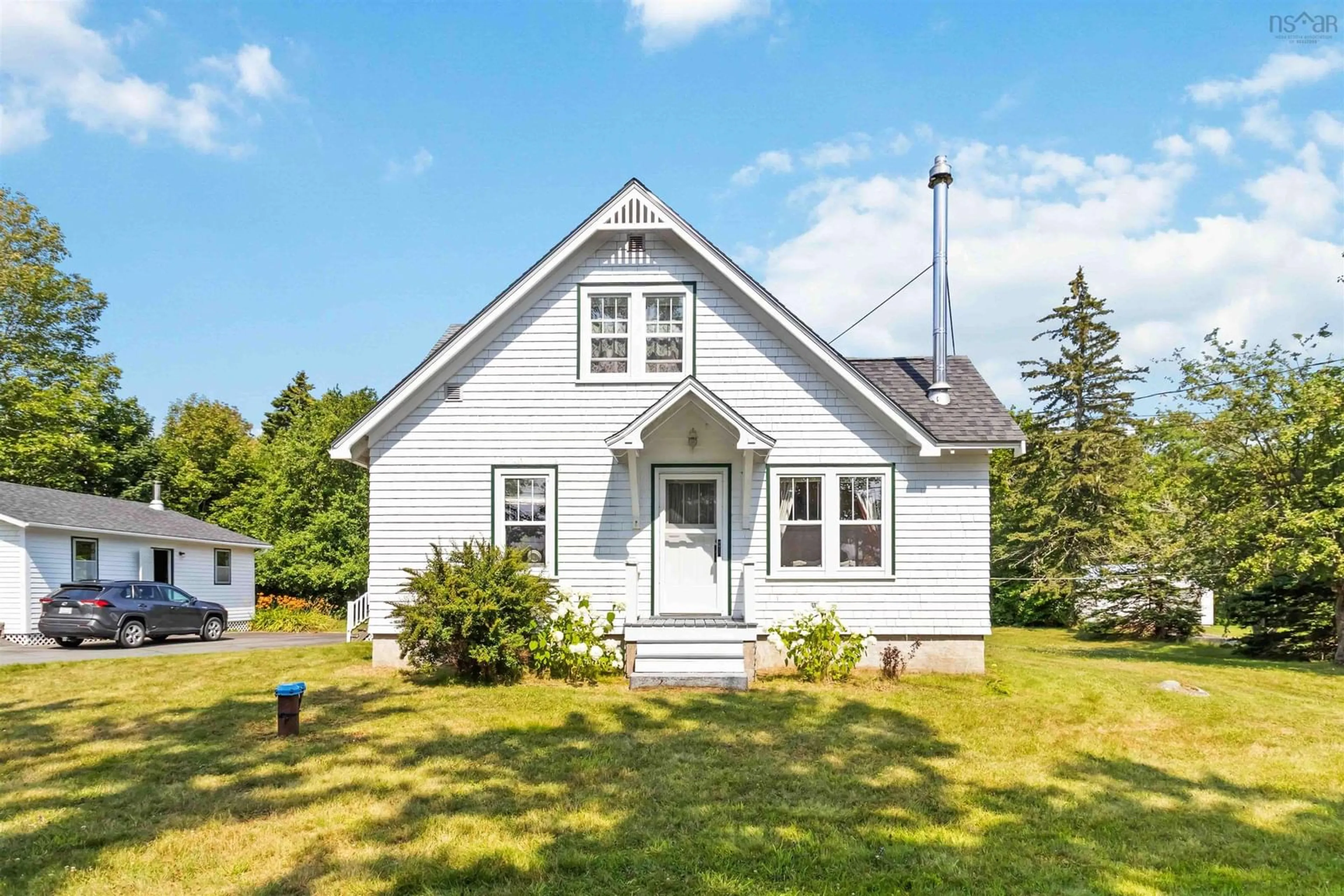 Home with vinyl exterior material, street for 42 Back Rd, Broad Cove Nova Scotia B0J 2H0