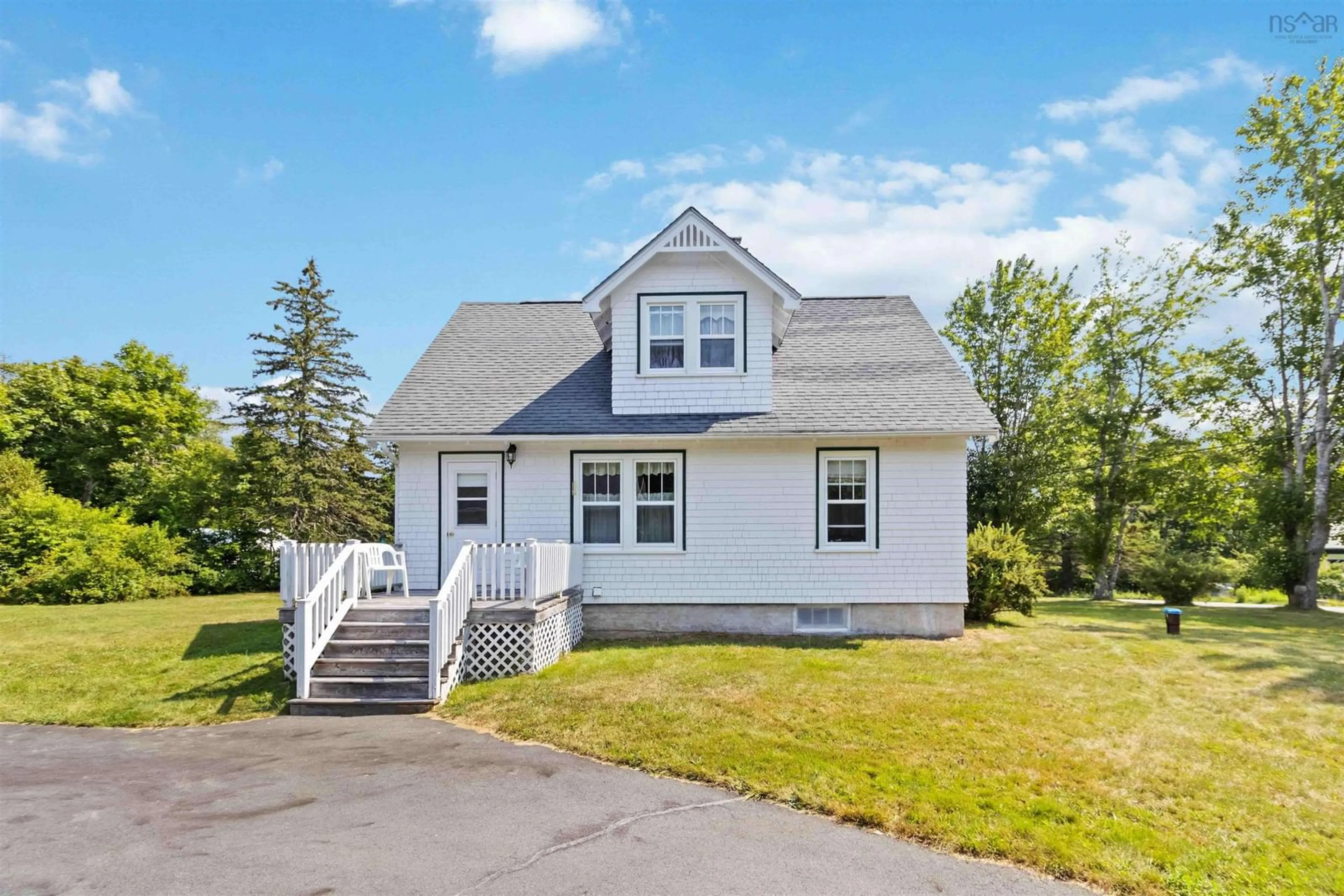 Home with vinyl exterior material, street for 42 Back Rd, Broad Cove Nova Scotia B0J 2H0