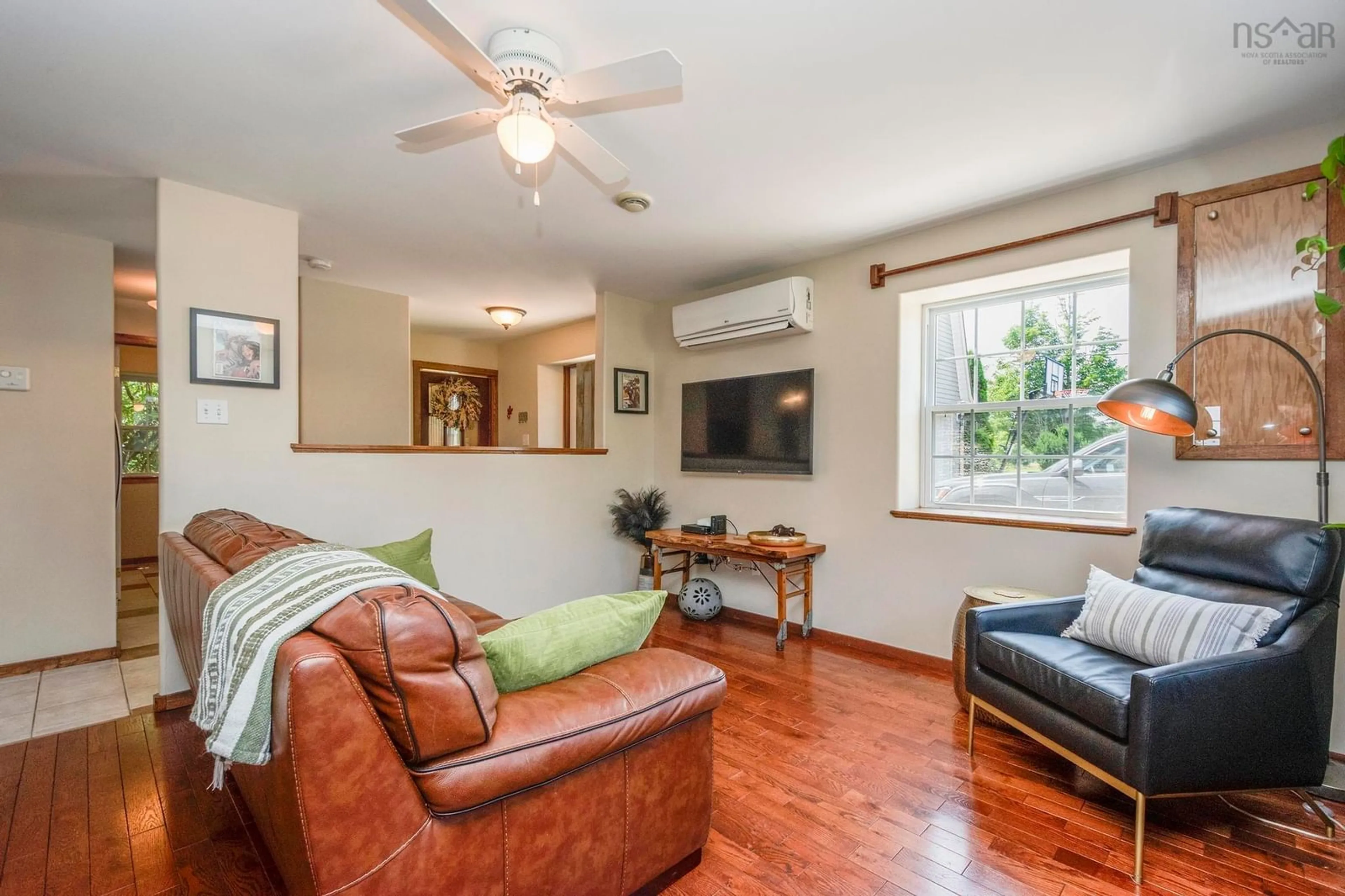 Living room with furniture, wood/laminate floor for 3010 Brooklyn St, Dempseys Corner Nova Scotia B0P 1C0