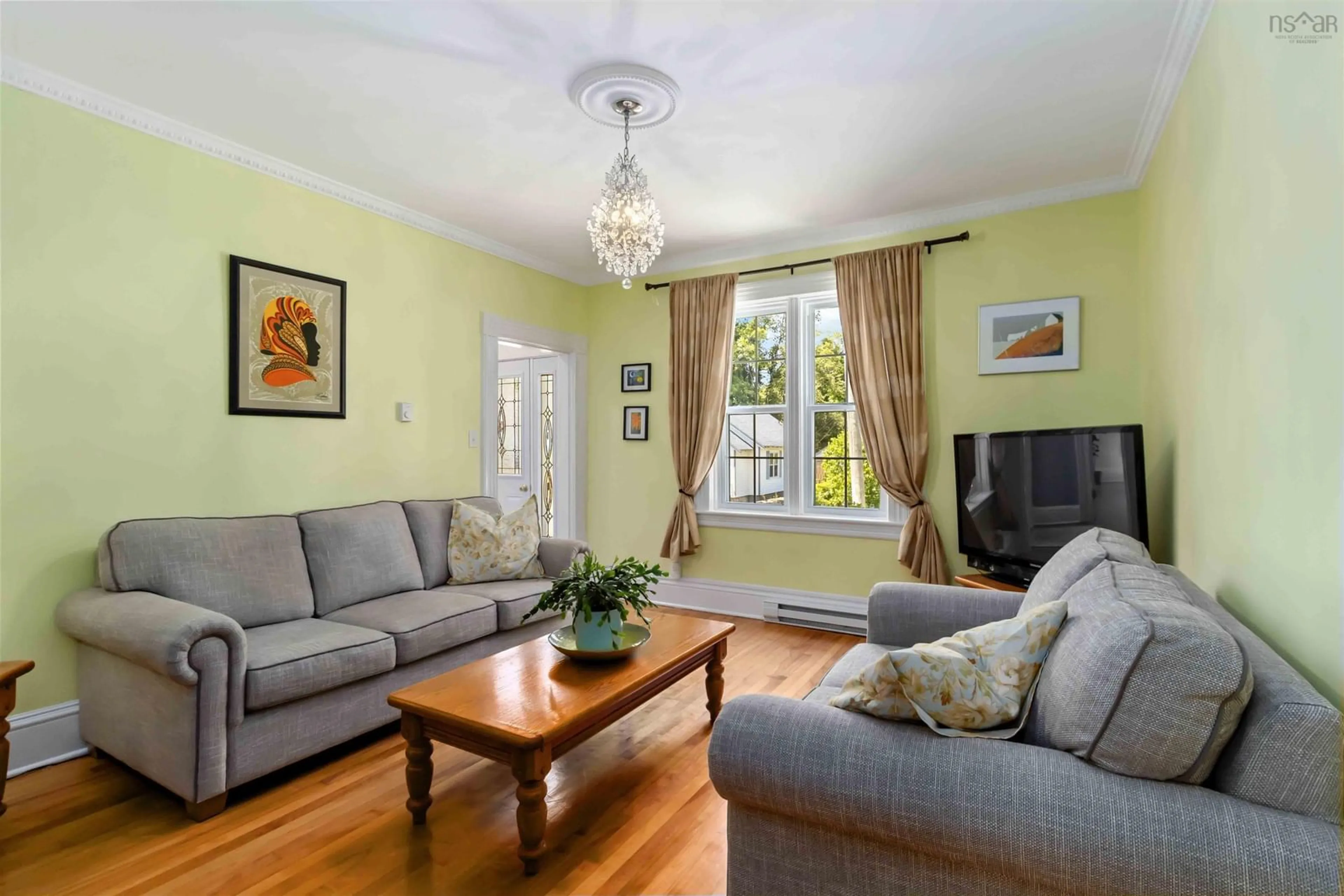 Living room with furniture, wood/laminate floor for 85 Church St, Liverpool Nova Scotia B0T 1K0
