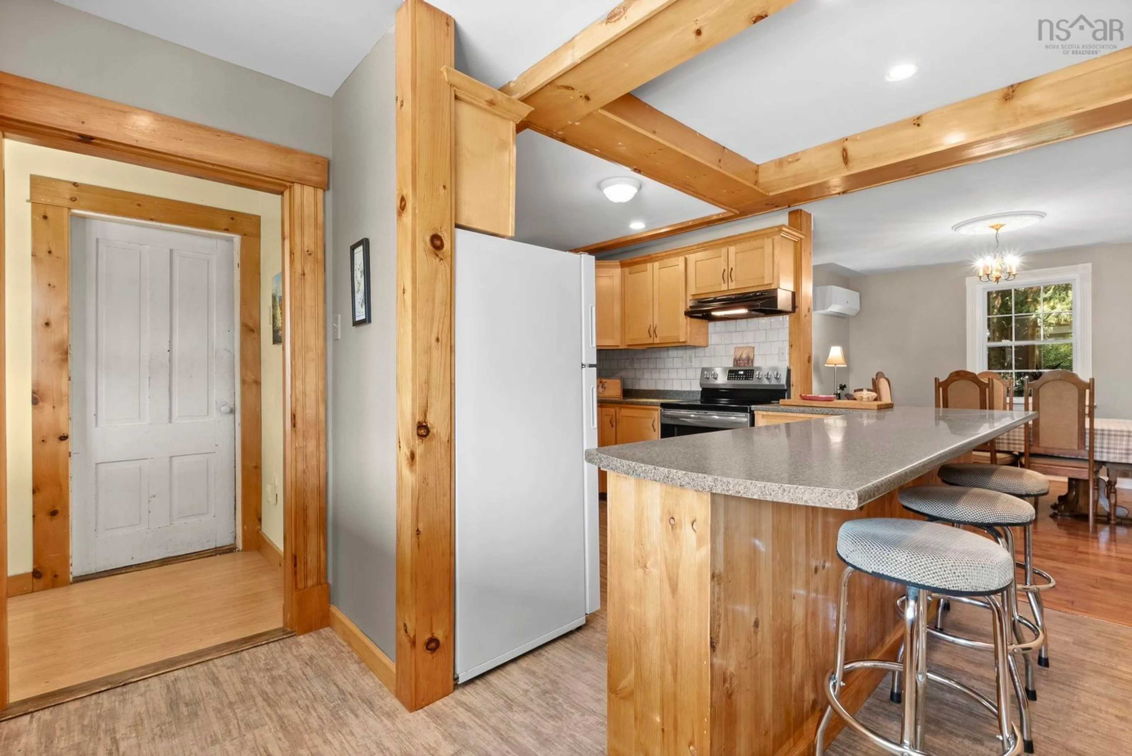 Open concept kitchen, wood/laminate floor for 1001 Brooklyn St, North Kingston Nova Scotia B0P 1N0