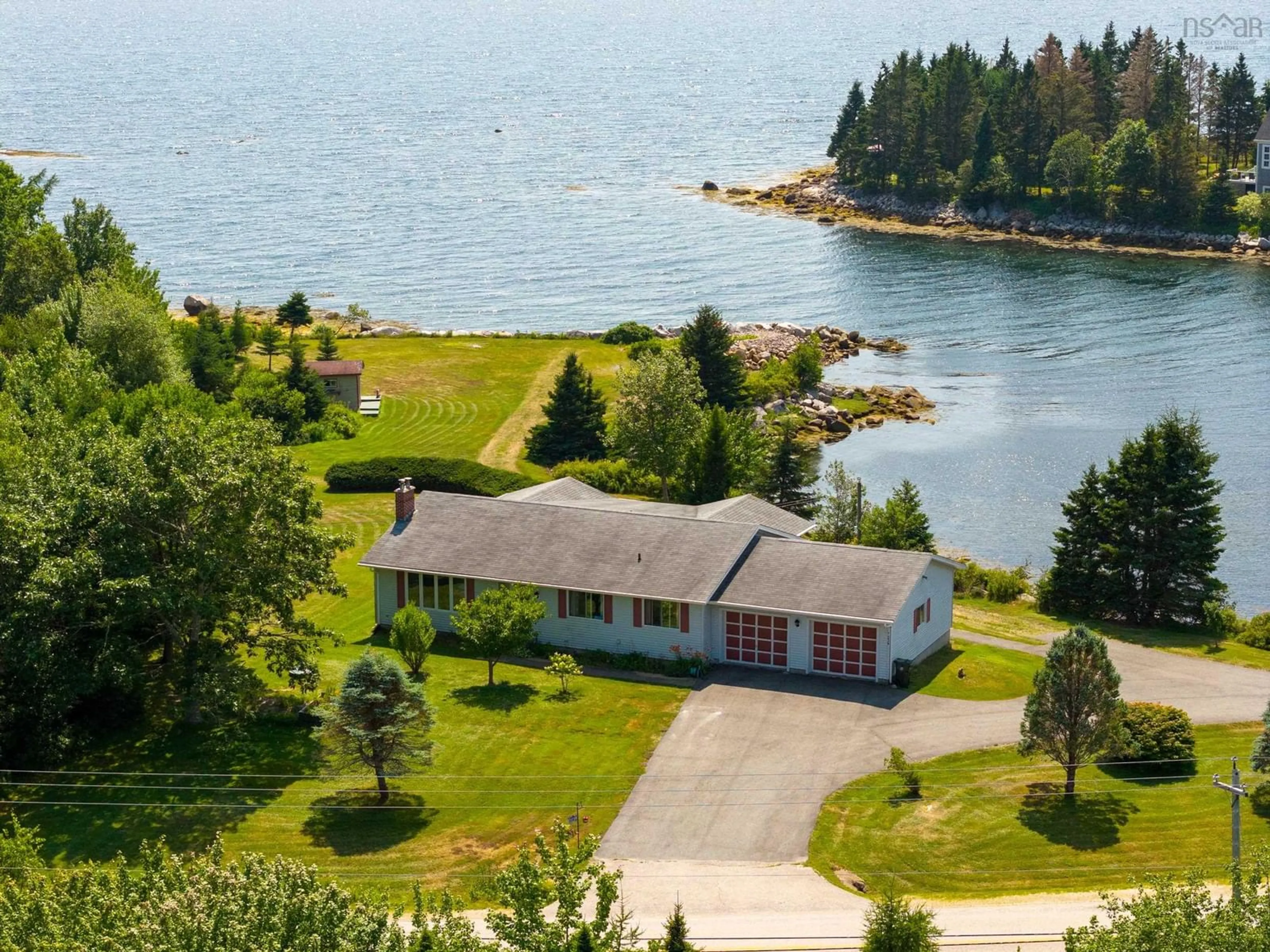 A pic from outside/outdoor area/front of a property/back of a property/a pic from drone, water/lake/river/ocean view for 7239 Highway 329, East River Point Nova Scotia B0J 1T0